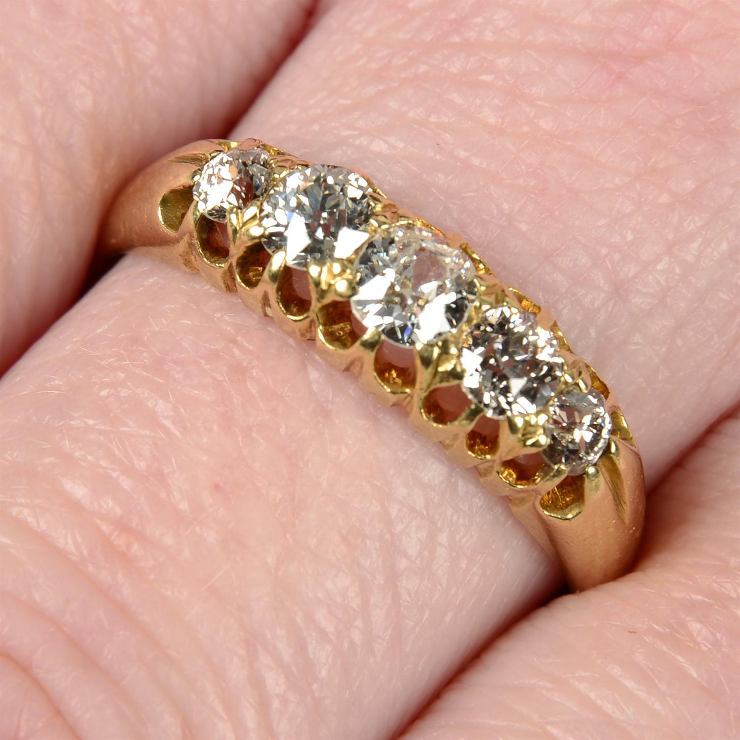 A late Victorian 18ct gold graduated old-cut diamond five-stone ring.