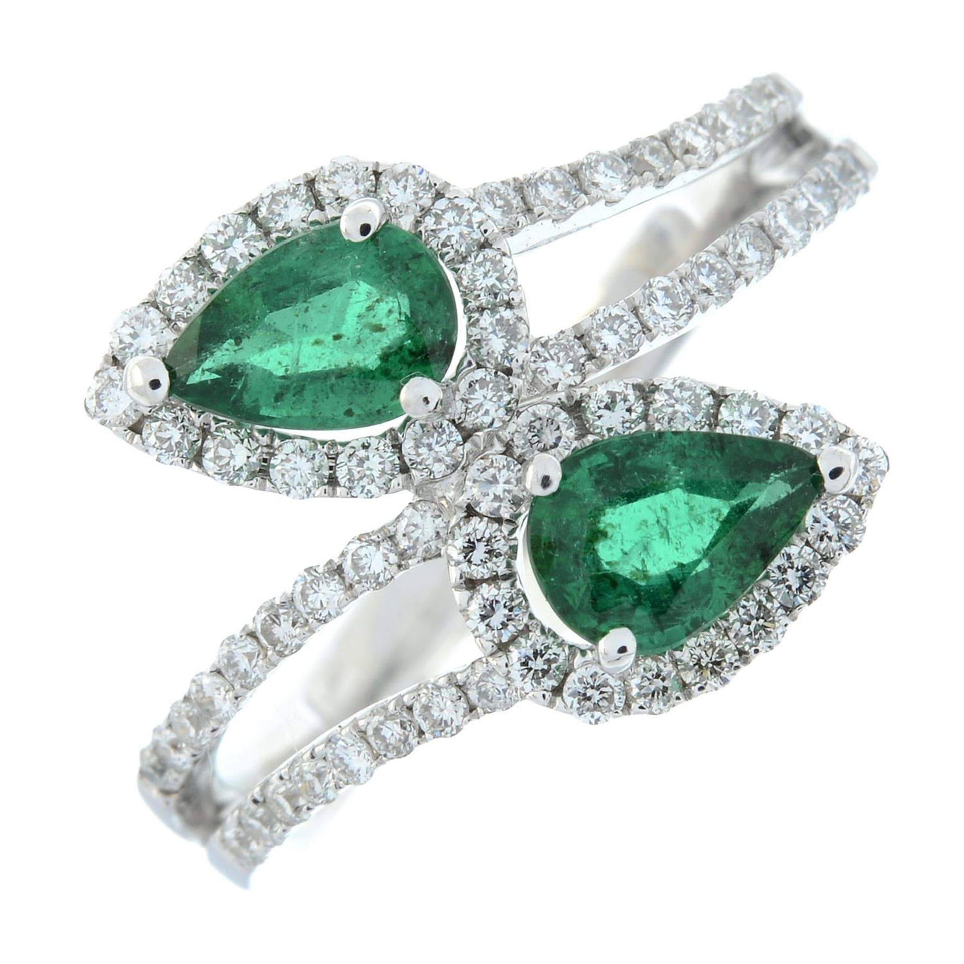 An emerald and brilliant-cut diamond crossover ring. - Image 2 of 5