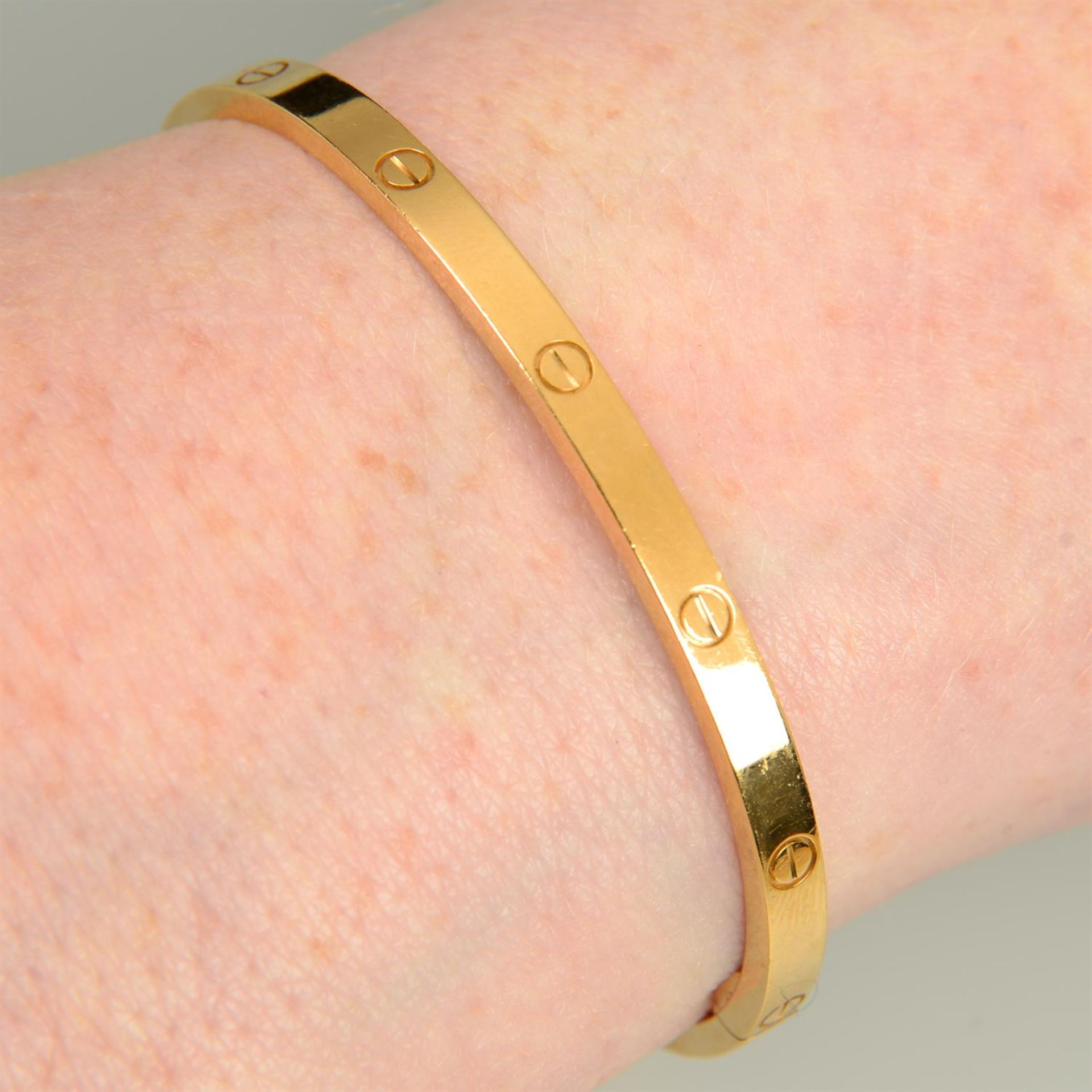 An 18ct gold 'Love' bangle, by Cartier.