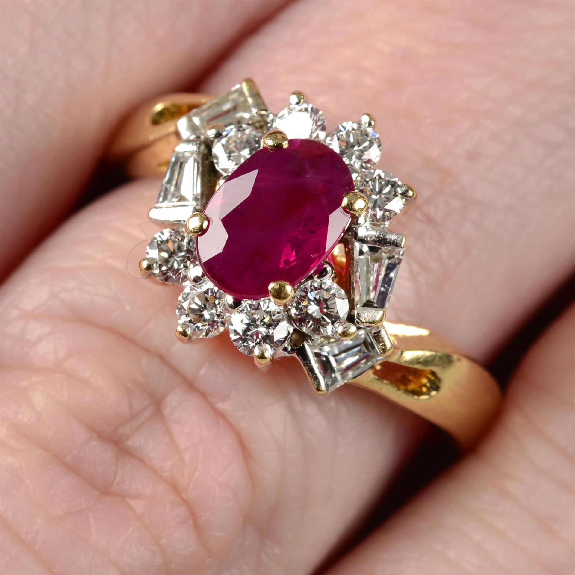 A ruby and vari-cut diamond cluster ring.