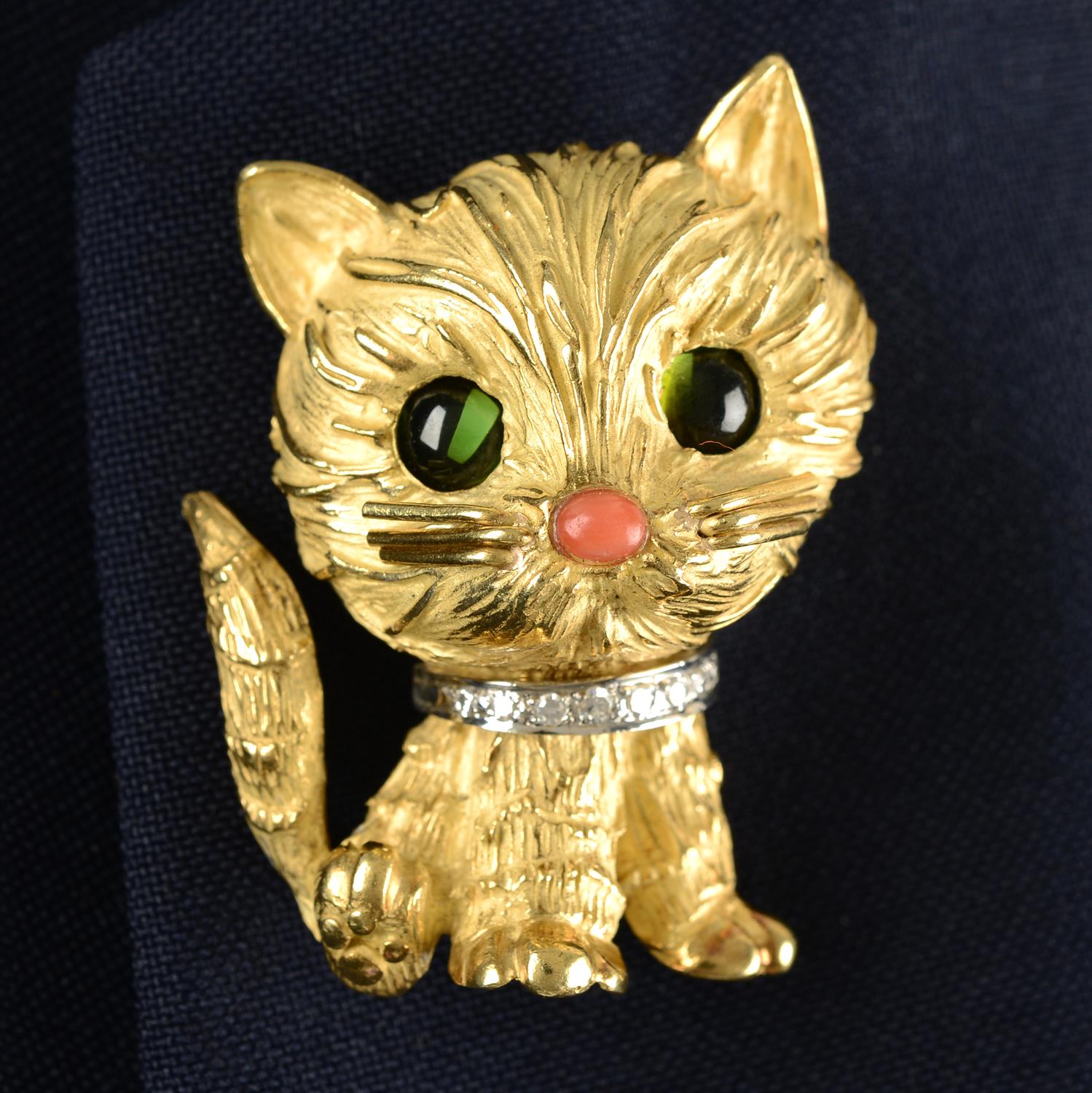 A mid 20th century 18ct gold cat brooch, with tourmaline eyes, coral nose and diamond collar,