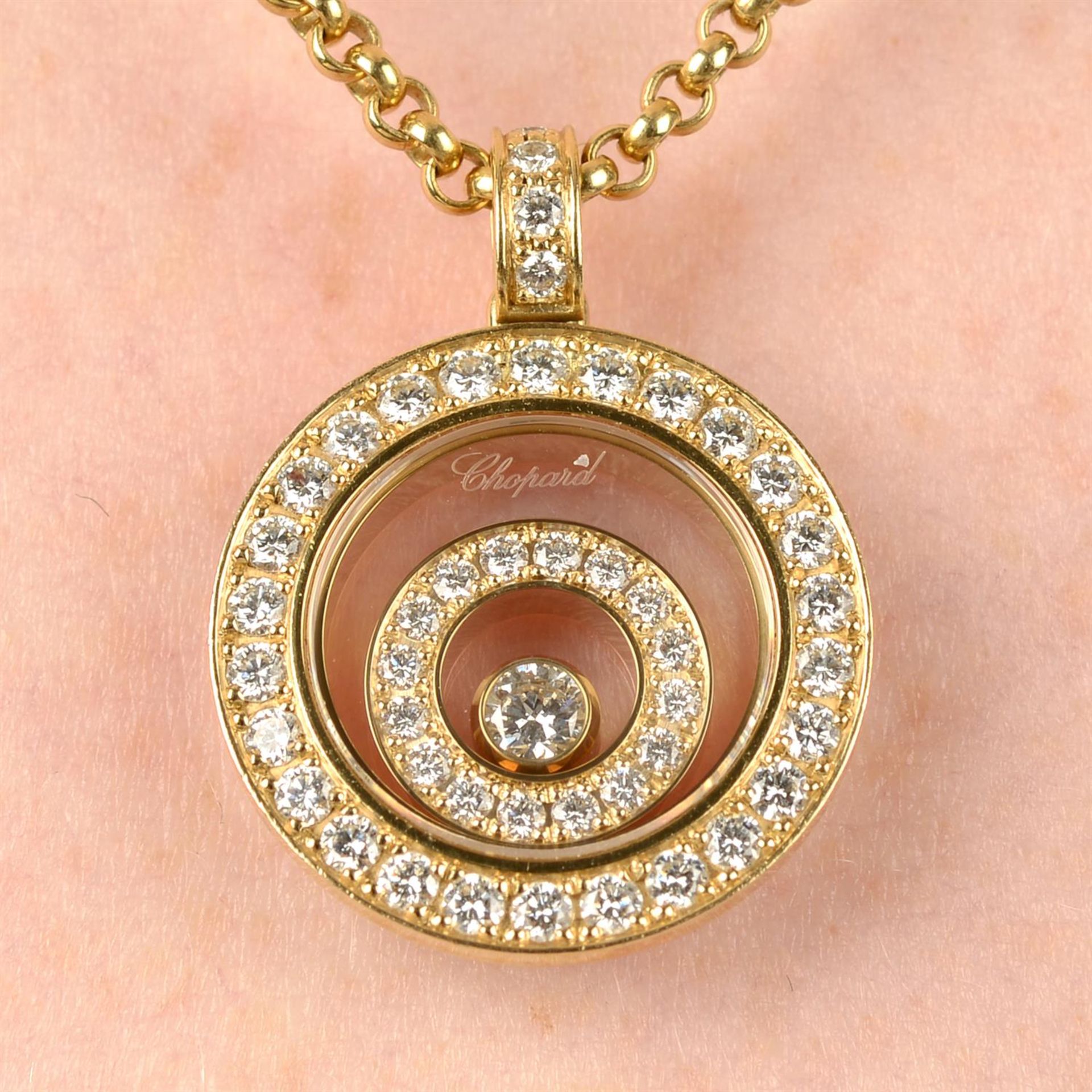 An 18ct gold brilliant-cut diamond 'Happy Spirit' pendant, with chain, by Chopard.