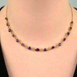 An early 20th century platinum and 18ct gold amethyst necklace.