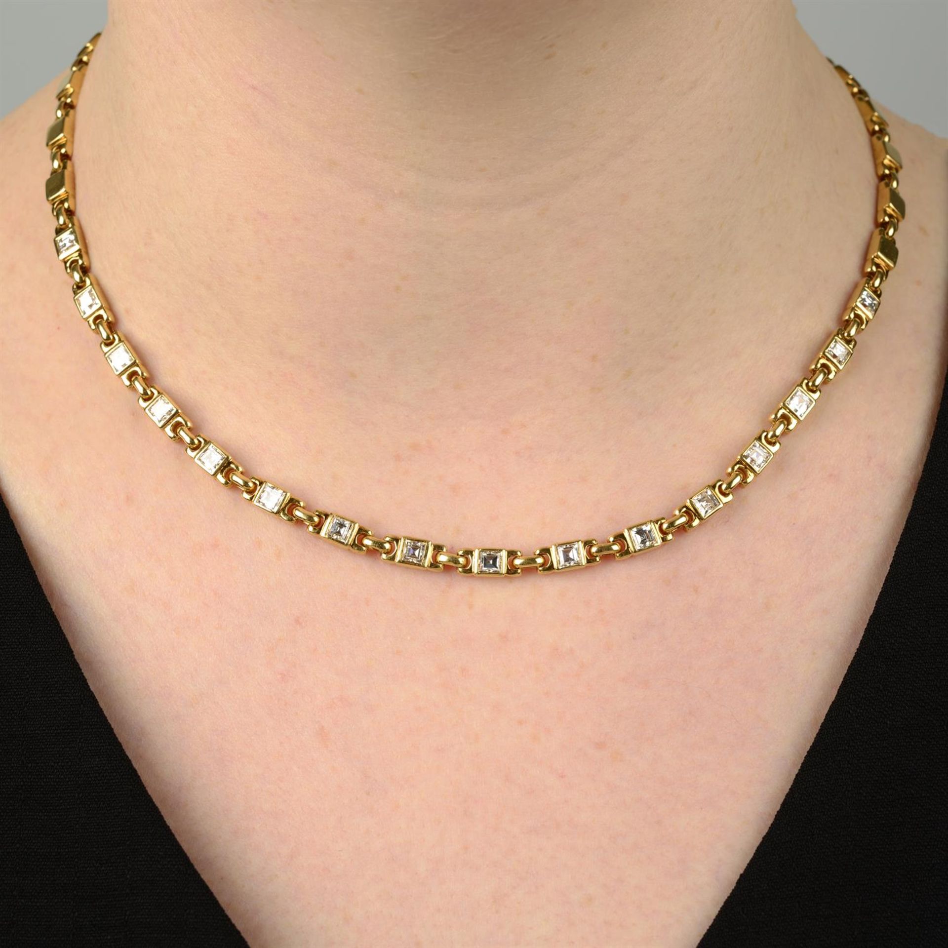 A square-shape diamond necklace, with similarly-designed polished back-chain.