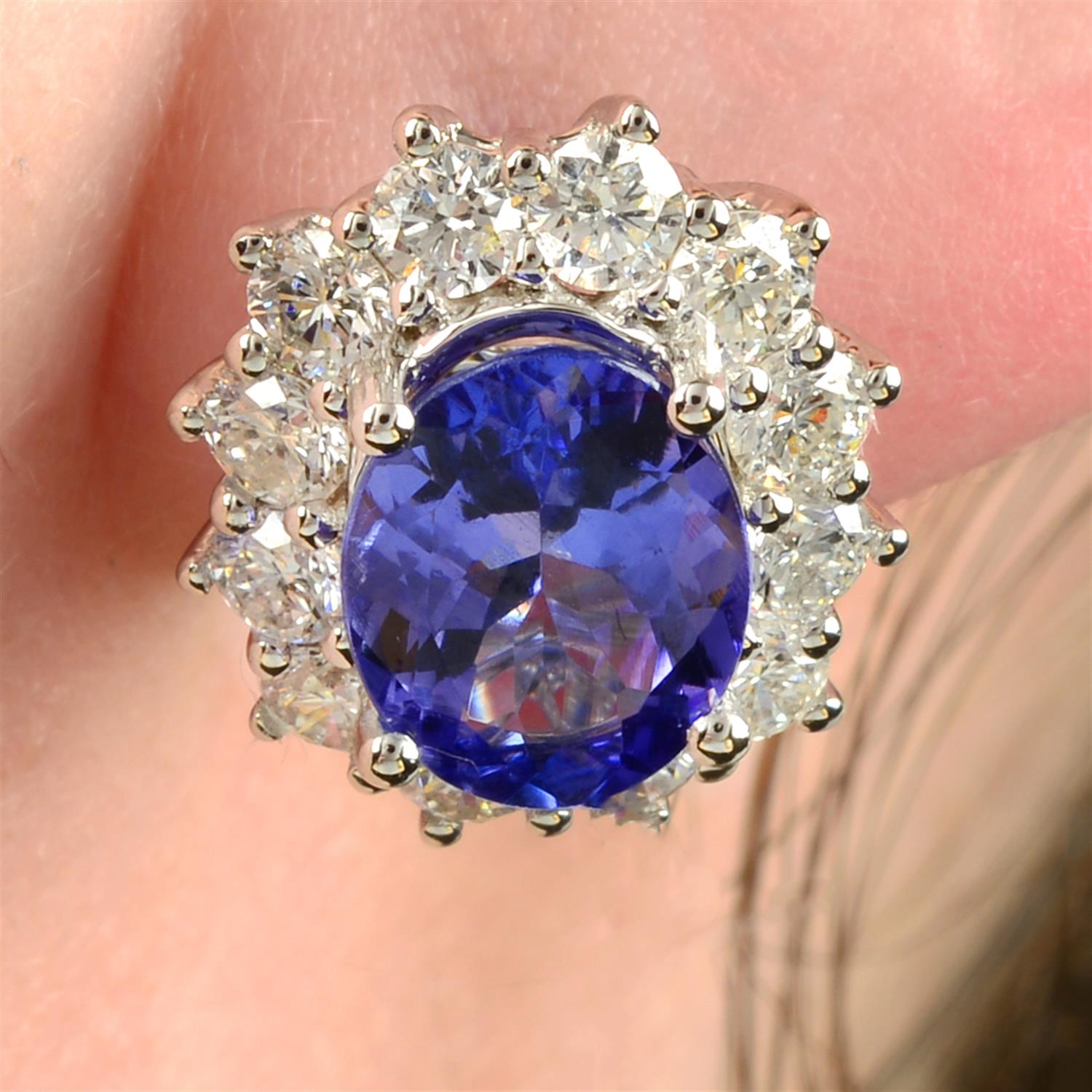 A pair of 18ct gold tanzanite and brilliant-cut diamond cluster earrings.