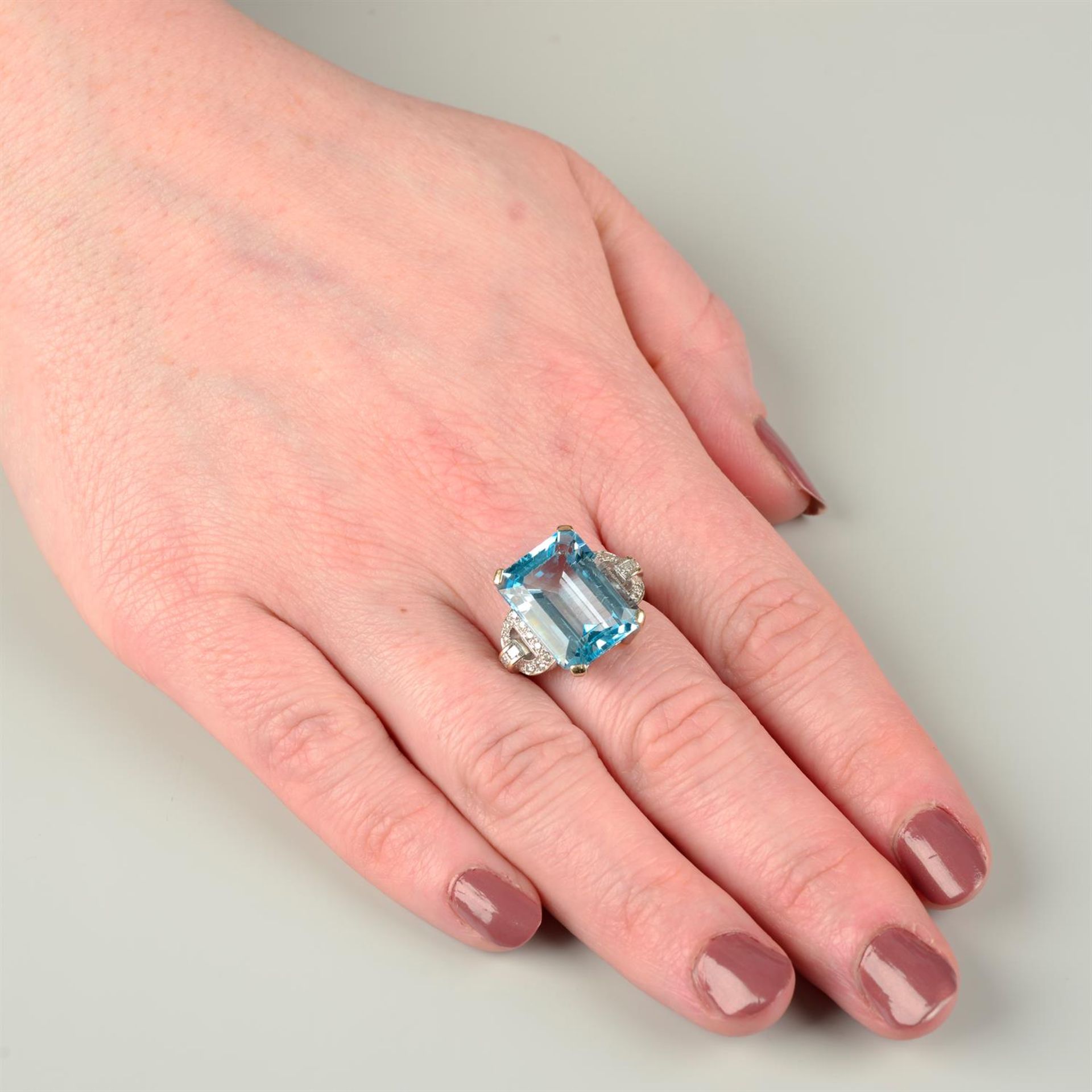 An 18ct gold blue topaz single-stone ring, with vari-cut diamond geometric sides. - Image 5 of 5