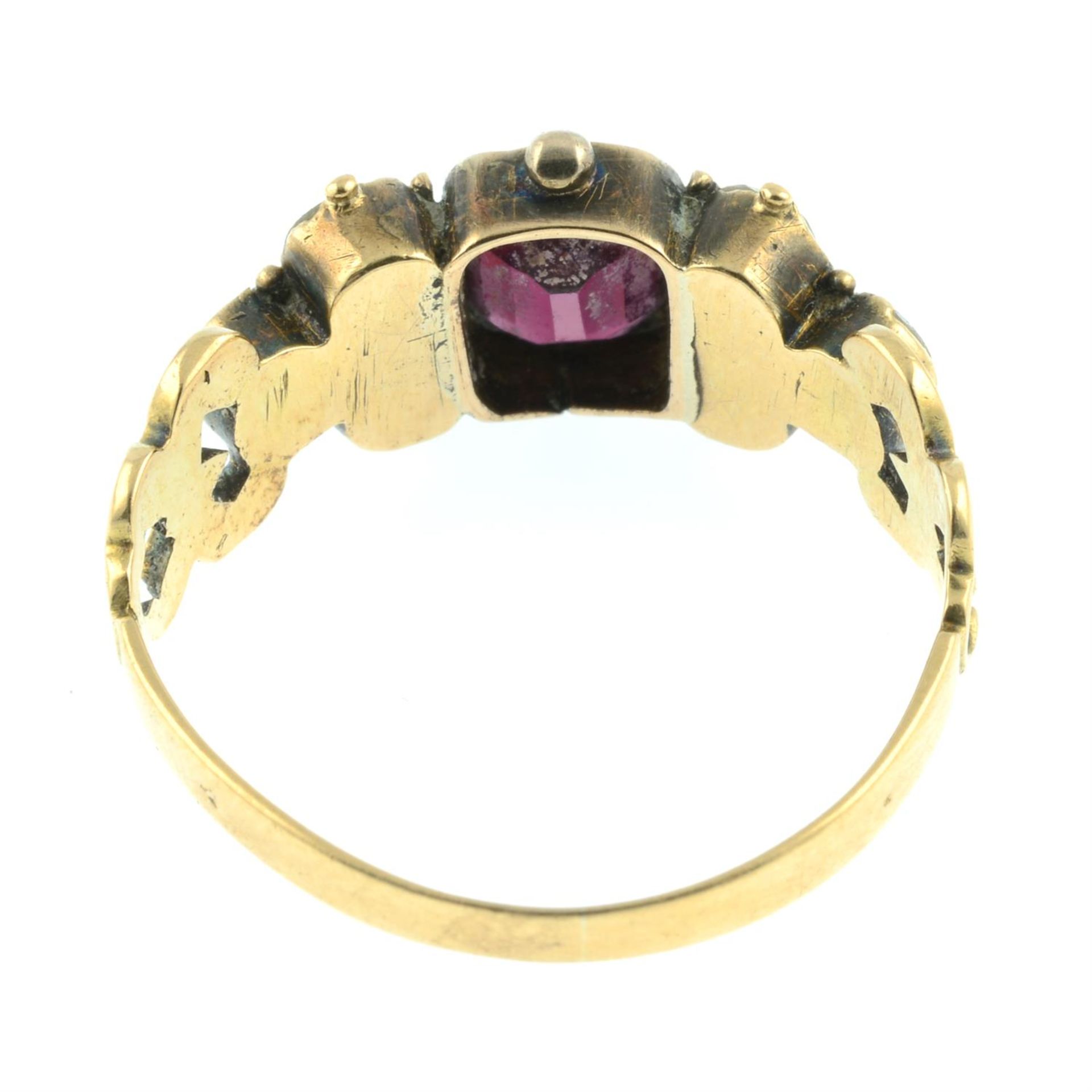 An early to mid 19th century gold garnet and chrysoberyl ring, with scrolling shoulders. - Image 4 of 5