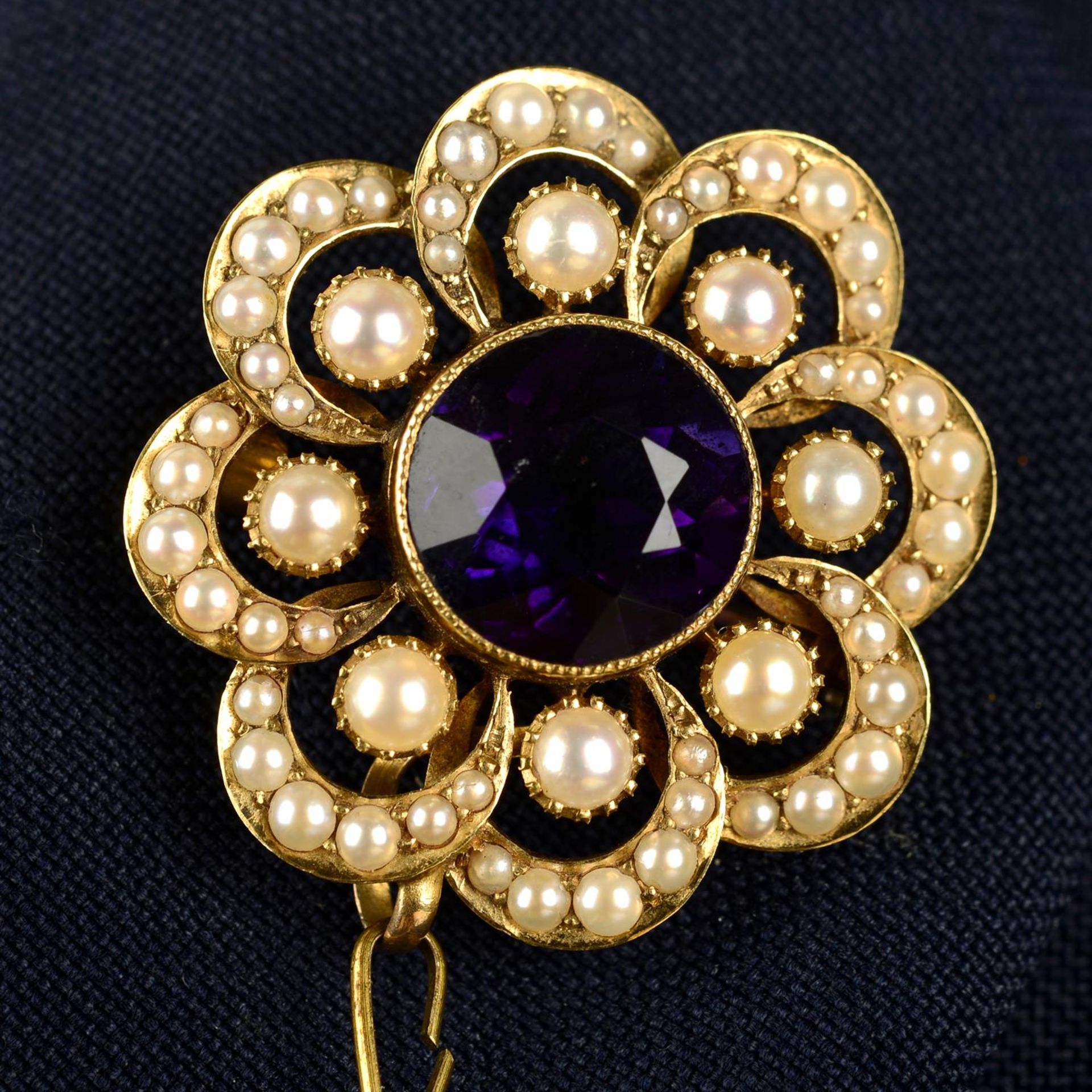 A Victorian 15ct gold split pearl and amethyst floral brooch/pendant.