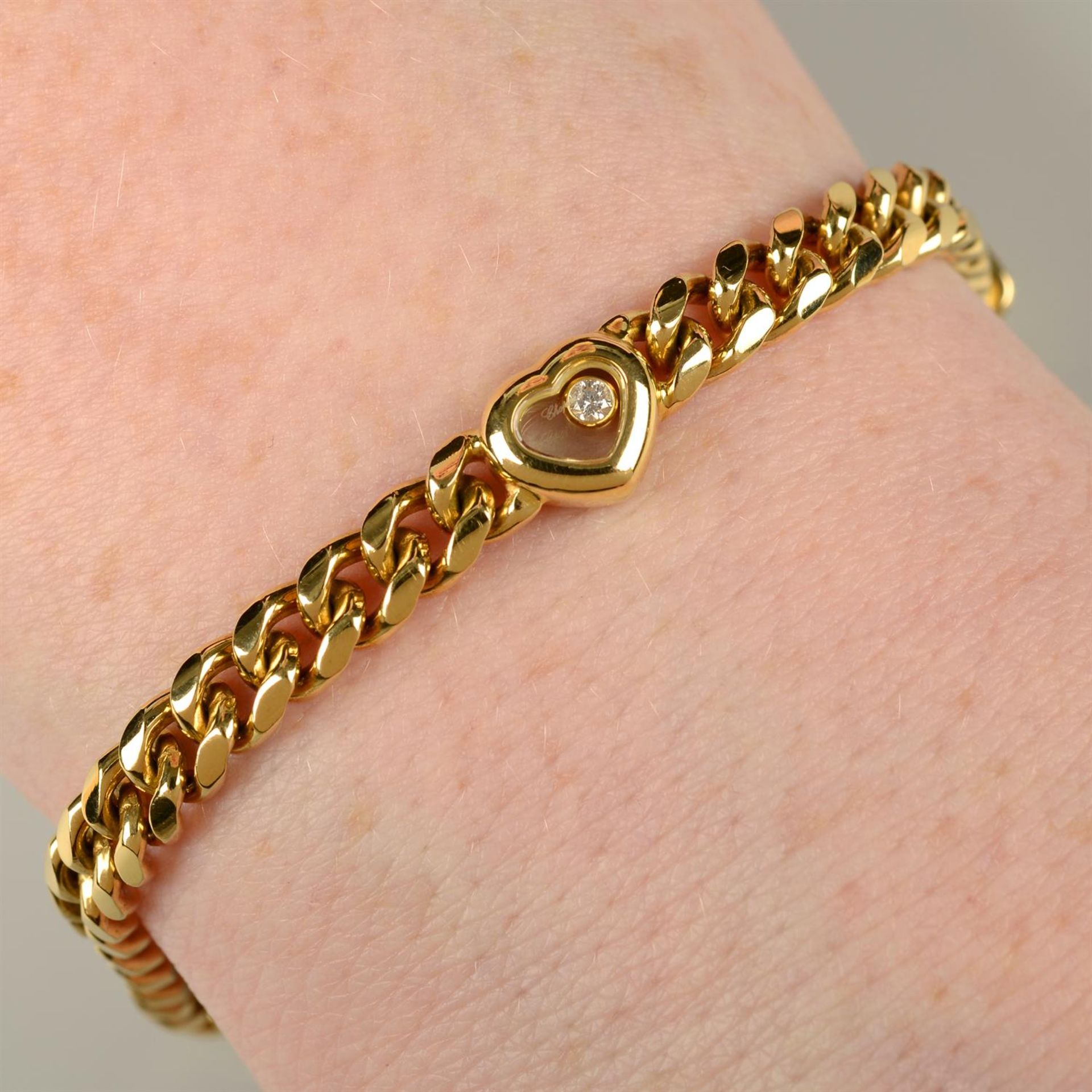 An 18ct gold 'Happy Diamonds' heart bracelet, by Chopard.