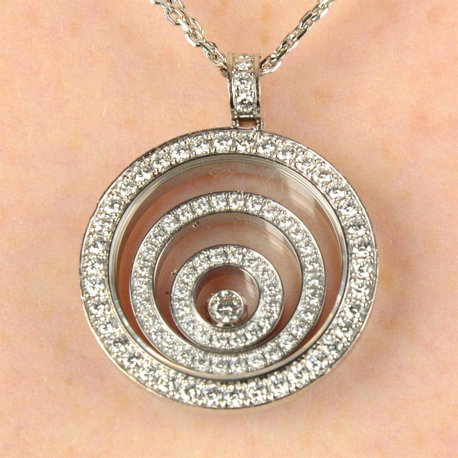 An 18ct gold diamond 'Happy Spirit' pendant, with chain, by Chopard.