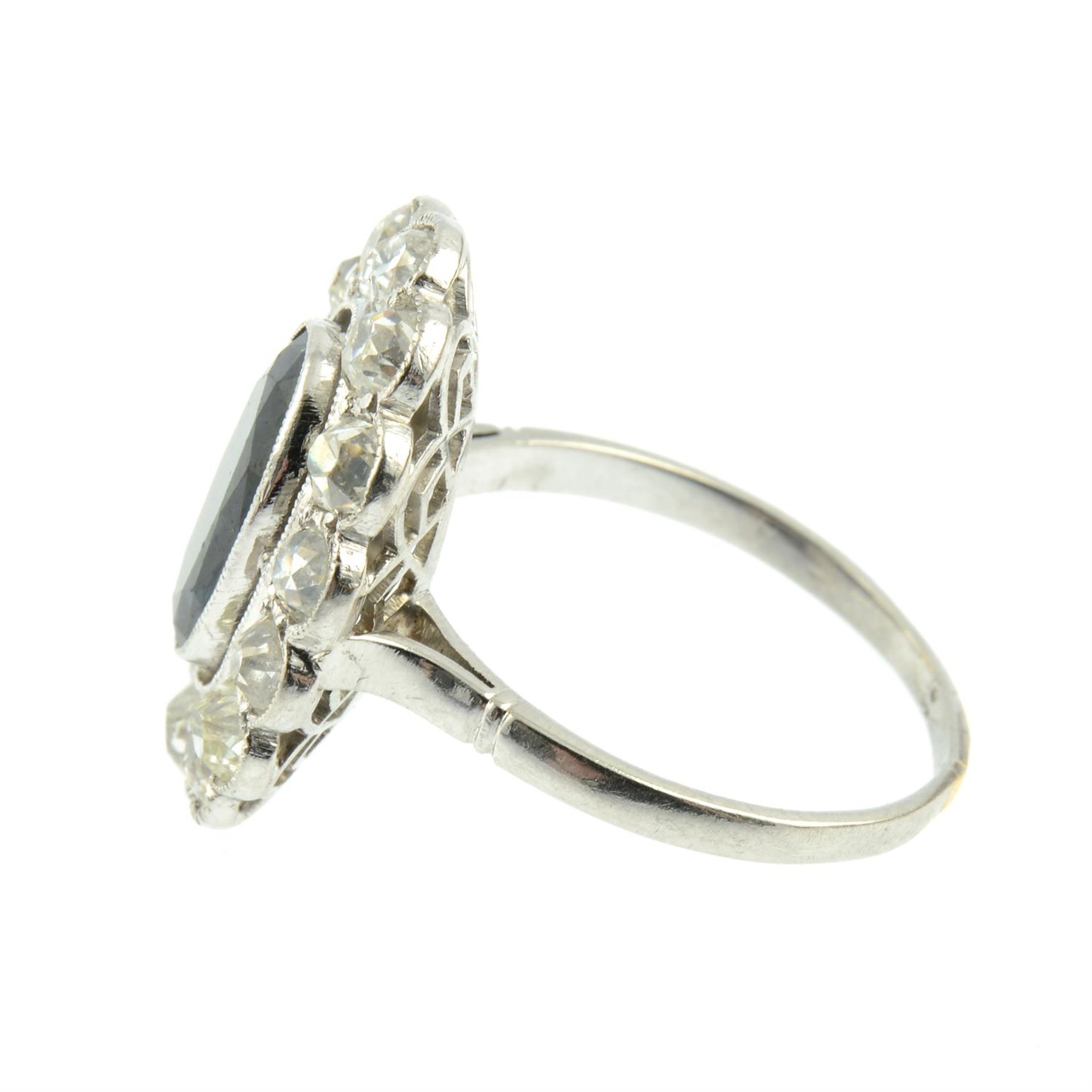 A mid 20th century platinum sapphire and old-cut diamond cluster ring. - Image 3 of 5