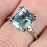 An 18ct gold aquamarine ring, with brilliant-cut diamond mount.
