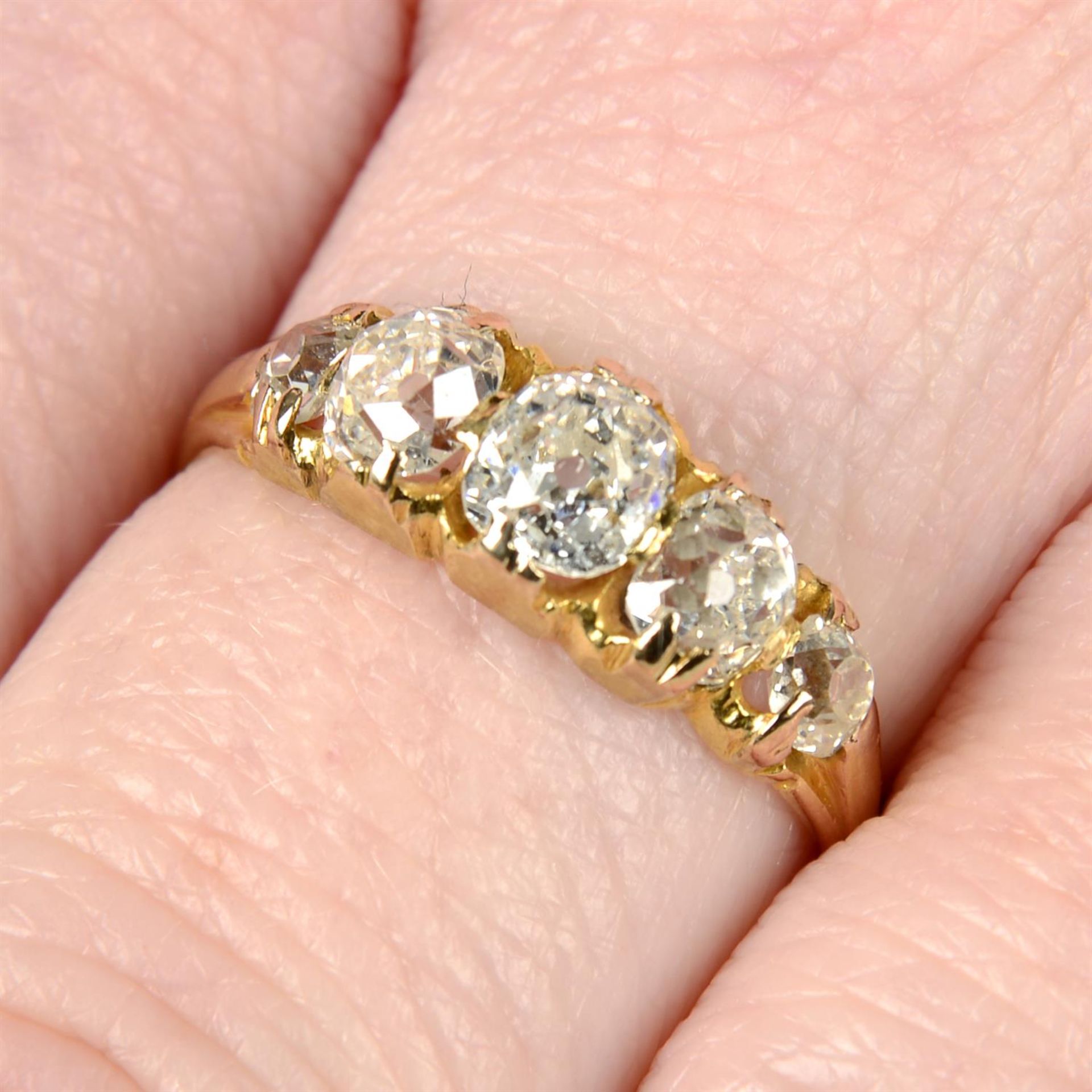 A late Victorian 18ct gold graduated old-cut diamond five-stone ring.