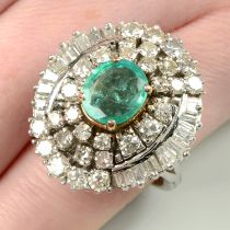 A mid 20th century 14ct gold emerald and vari-cut diamond cluster ring.