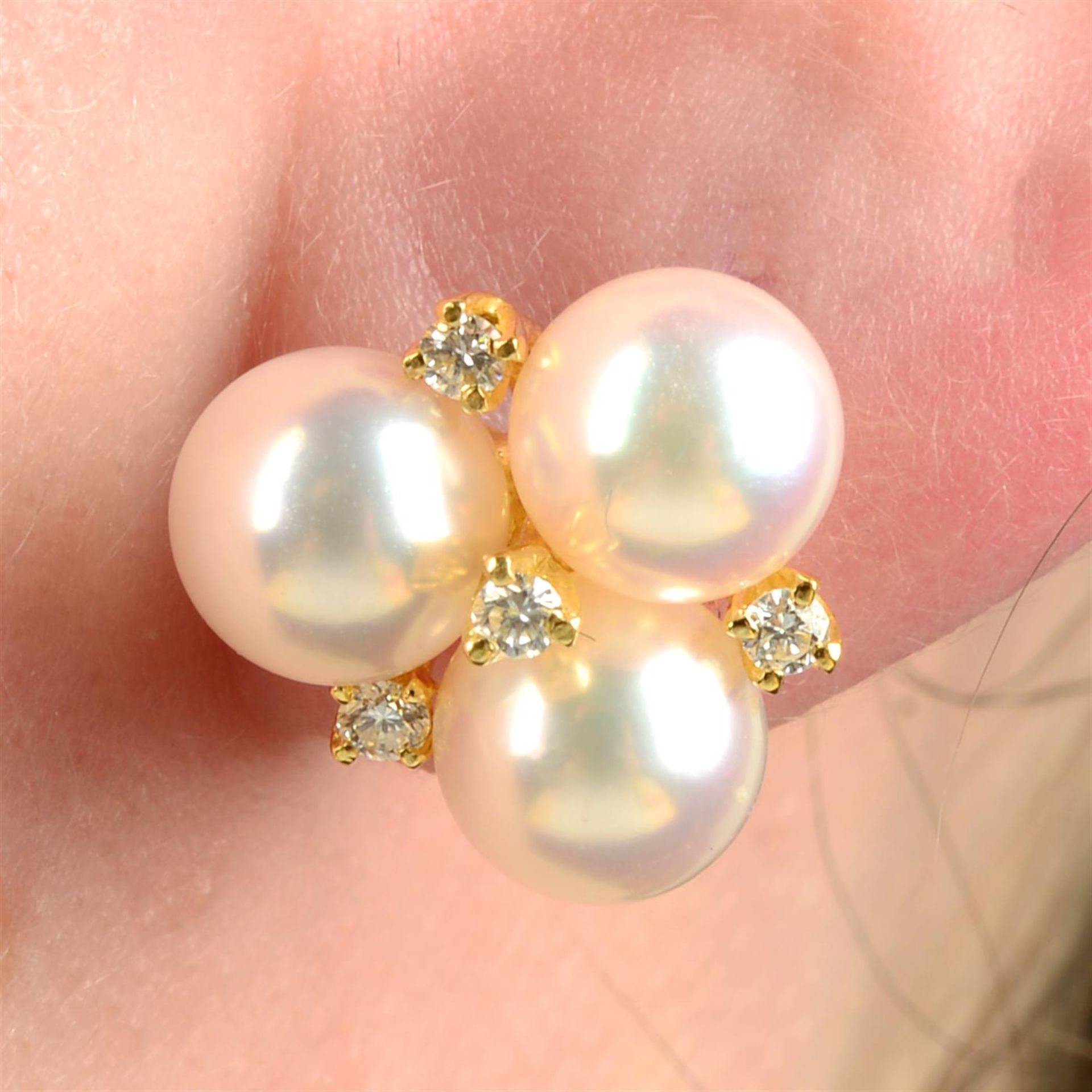 A pair of 18ct gold cultured pearl and brilliant-cut diamond earrings, by Mikimoto.