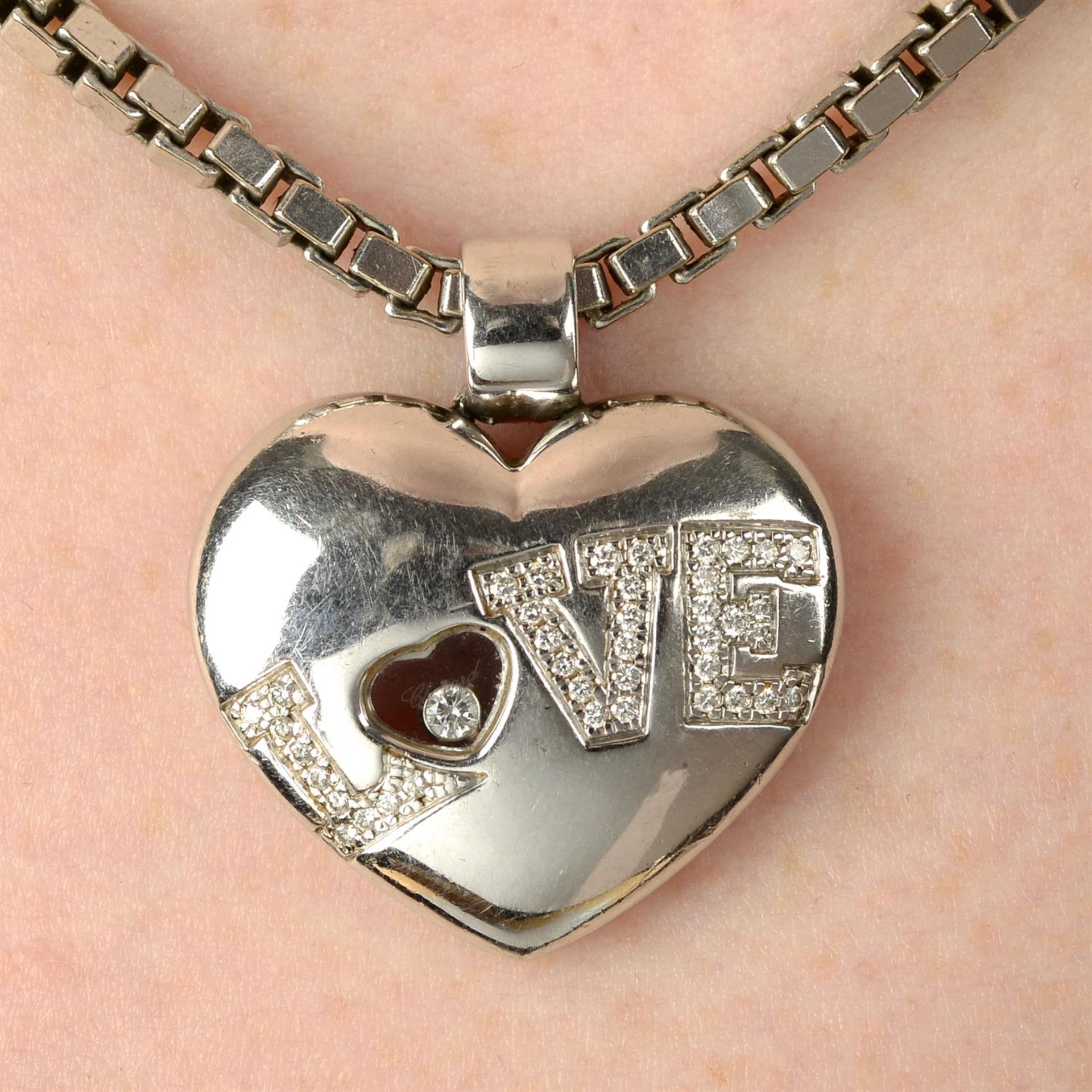 A 'Happy Diamonds' 'Love' pendant, with box-link chain, by Chopard.