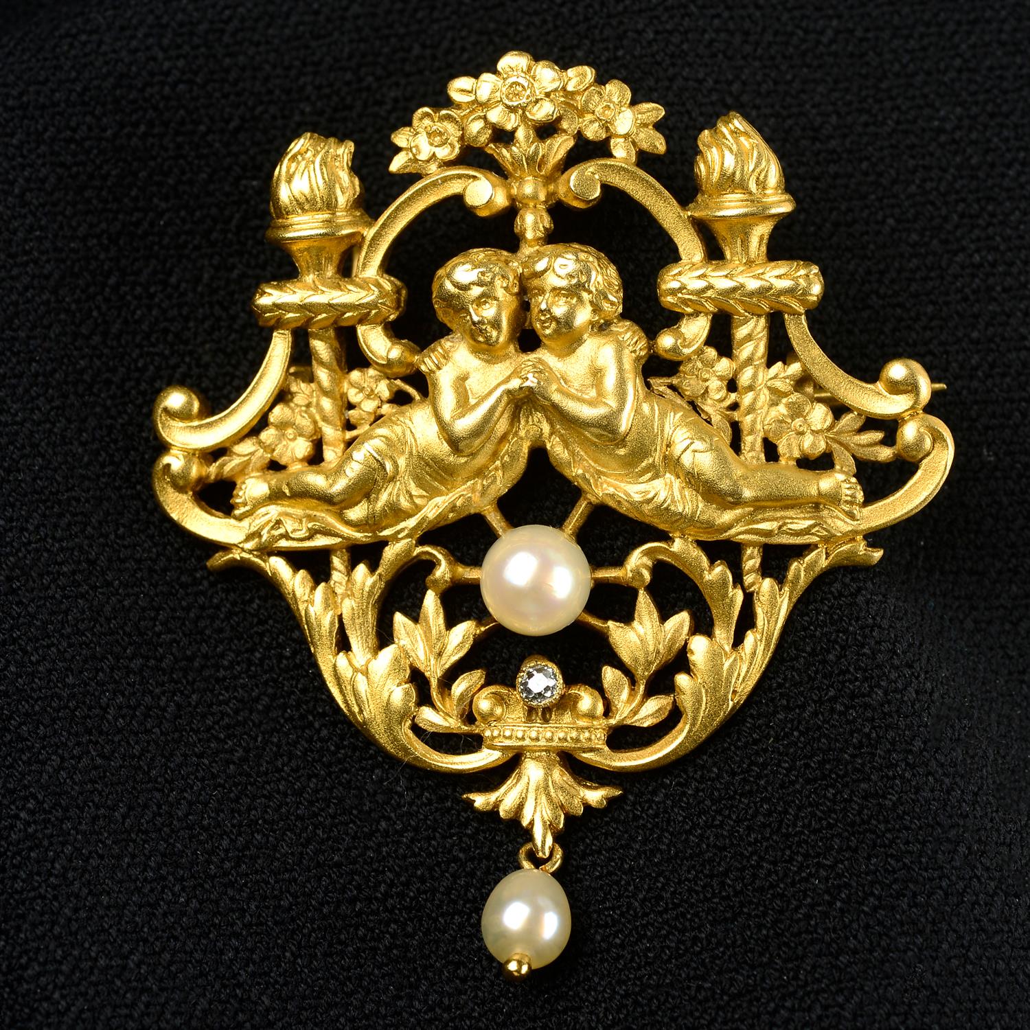 An early 20th century 18ct gold brooch of two embracing figures with diamond and cultured pearl