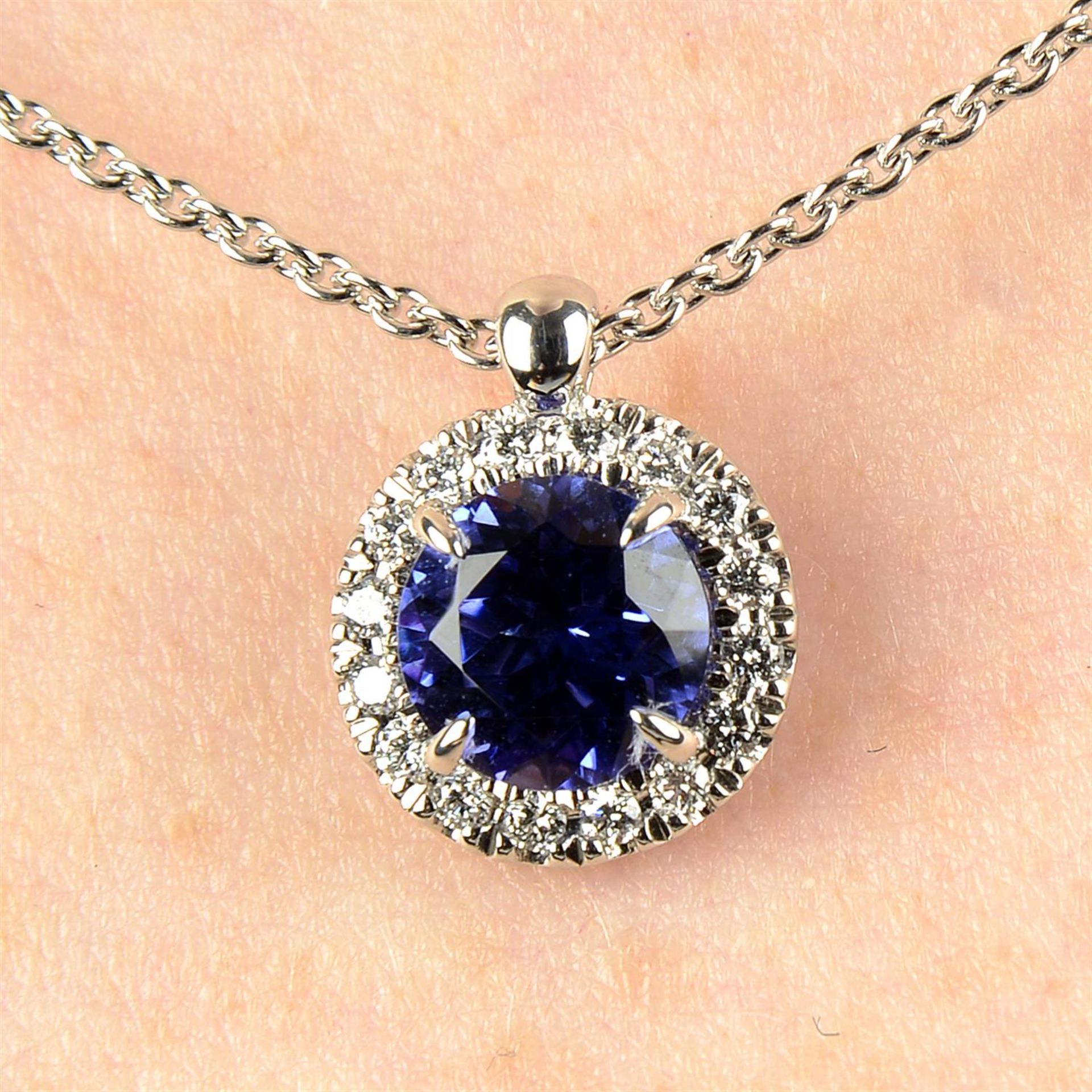 An 18ct gold tanzanite and brilliant-cut diamond 'Joy' pendant, on chain, by Bucherer.