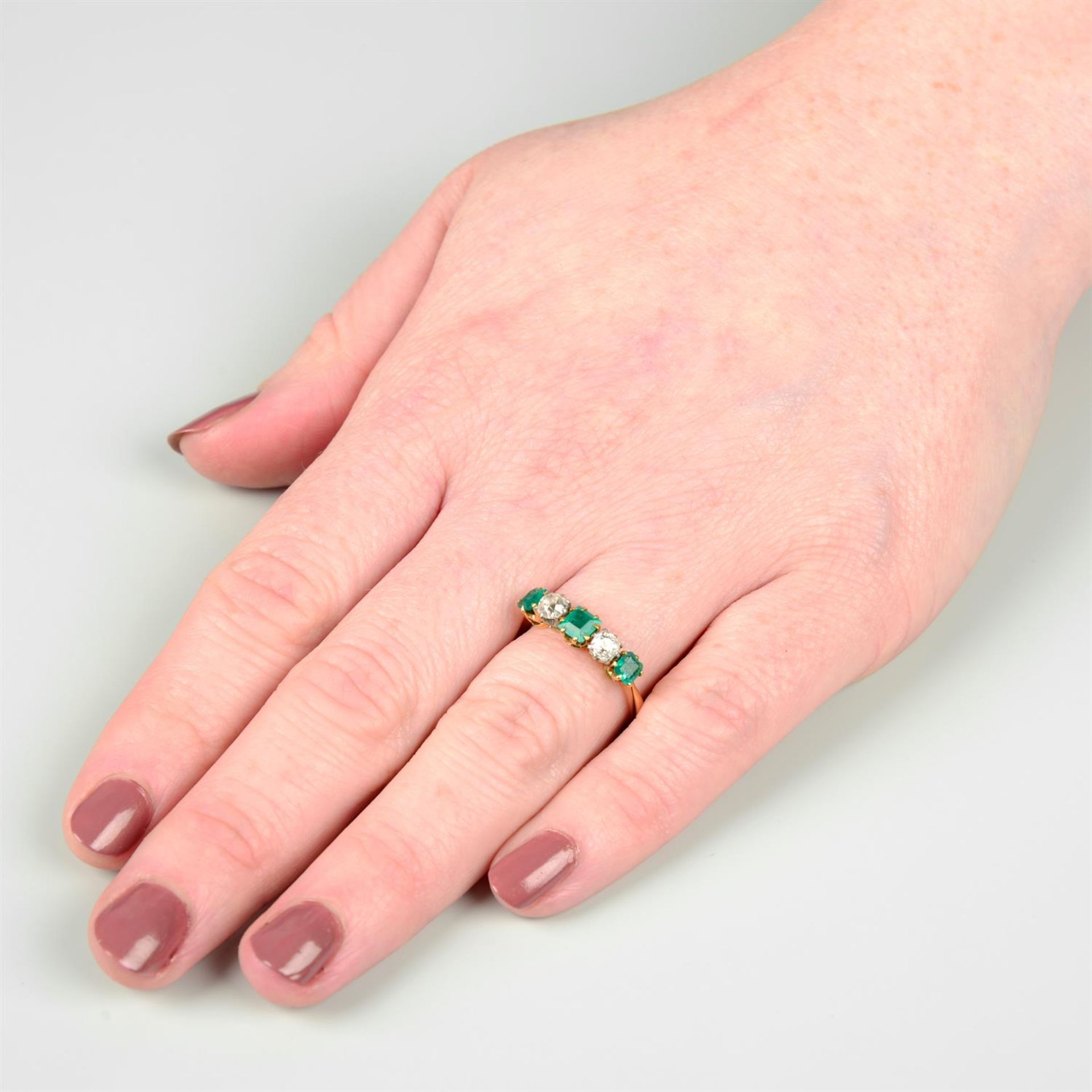 An Edwardian 18ct gold and platinum old-cut diamond and emerald five-stone ring. - Image 5 of 5