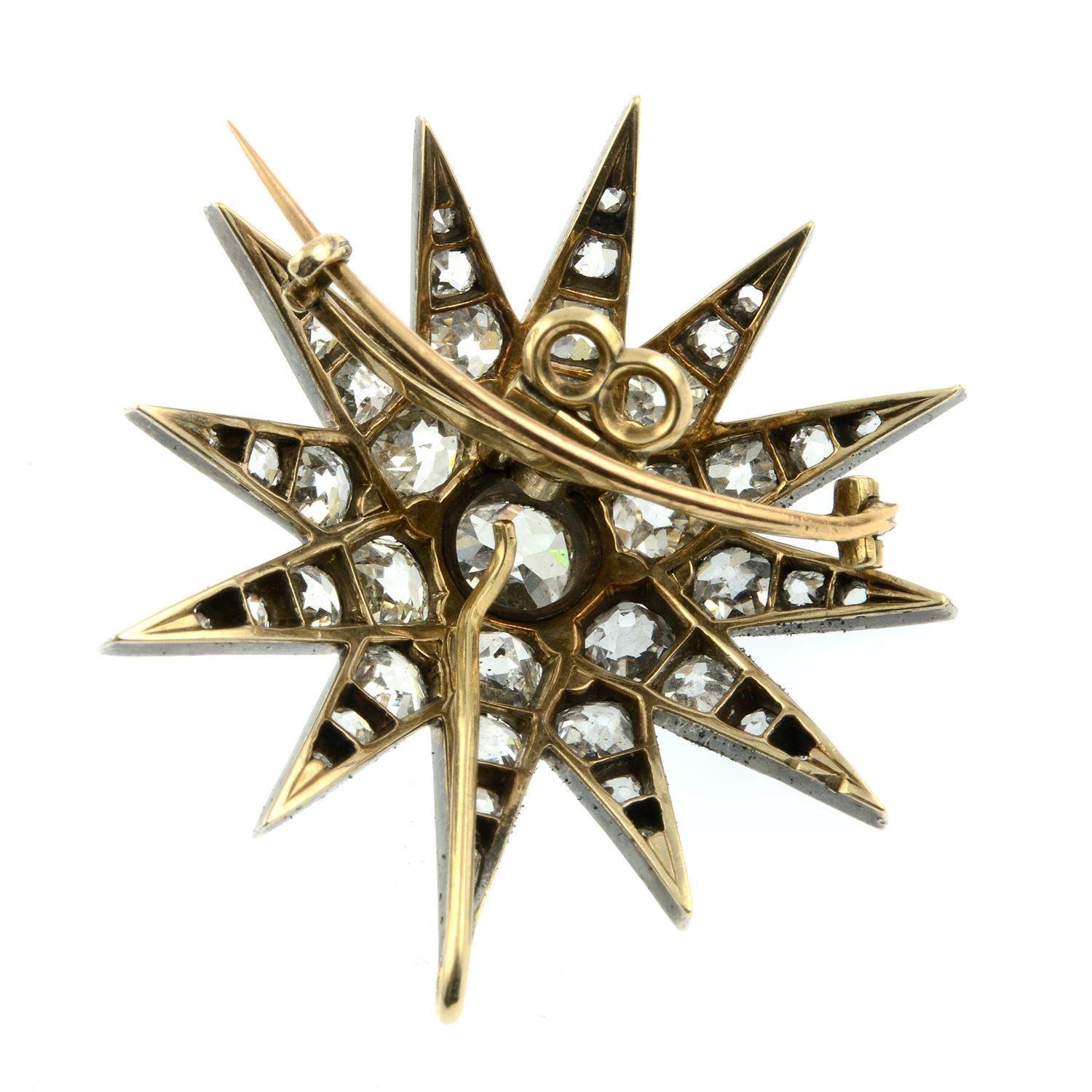 A late Victorian silver and gold old-cut diamond starburst pendant/brooch. - Image 3 of 4