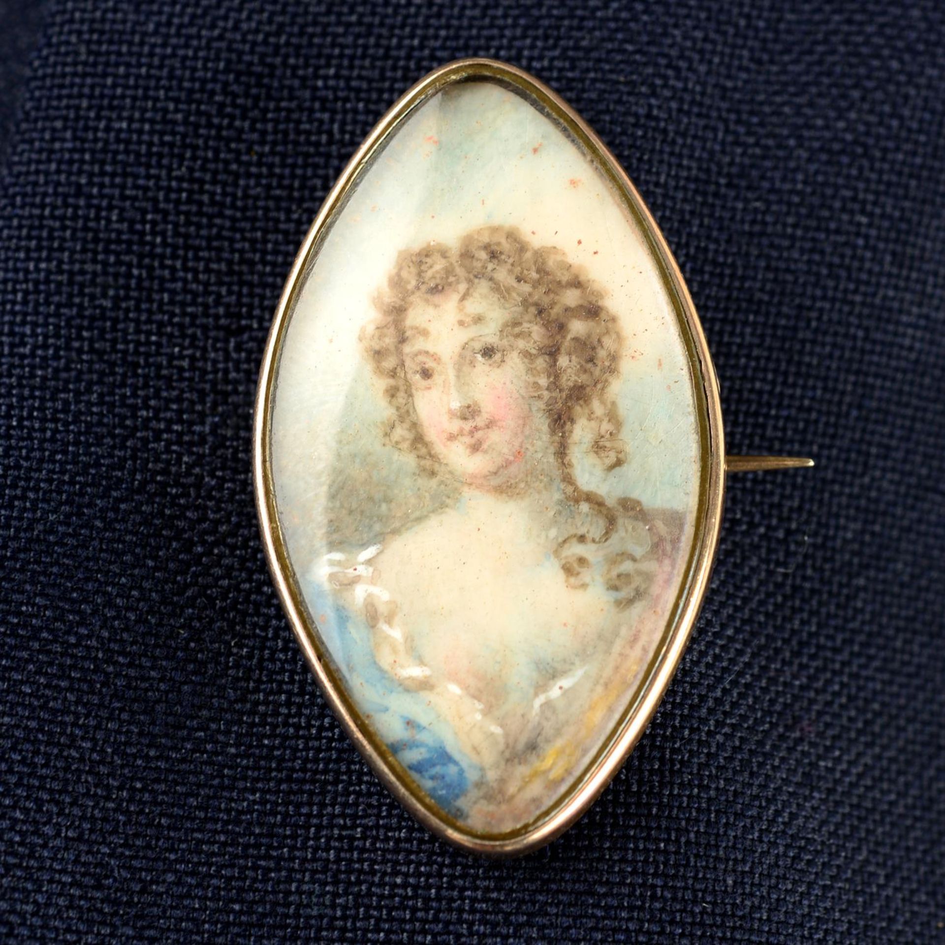 A Georgian gold portrait miniature brooch, depicting a woman.