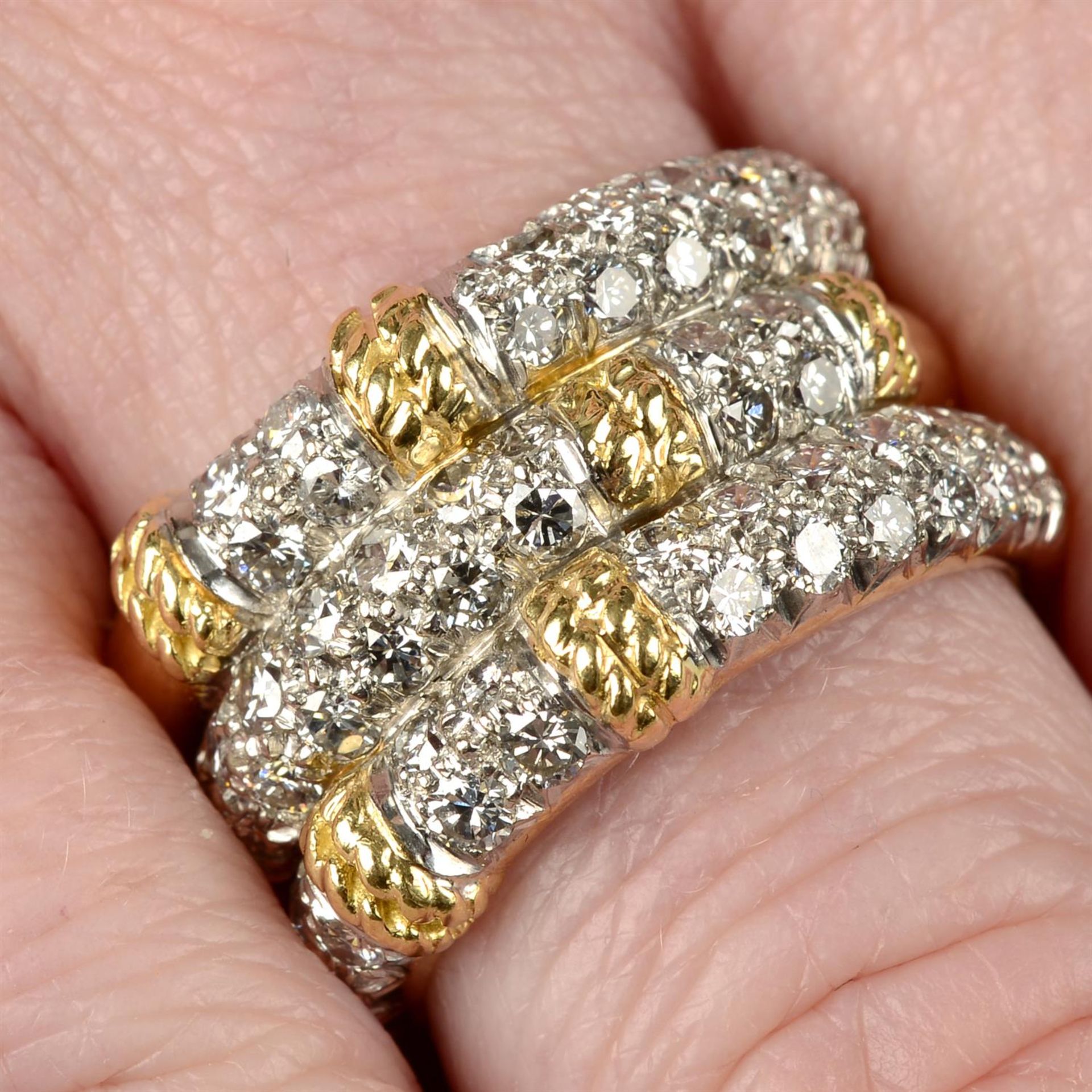 A mid 20th century 18ct gold brilliant-cut diamond grooved band ring.