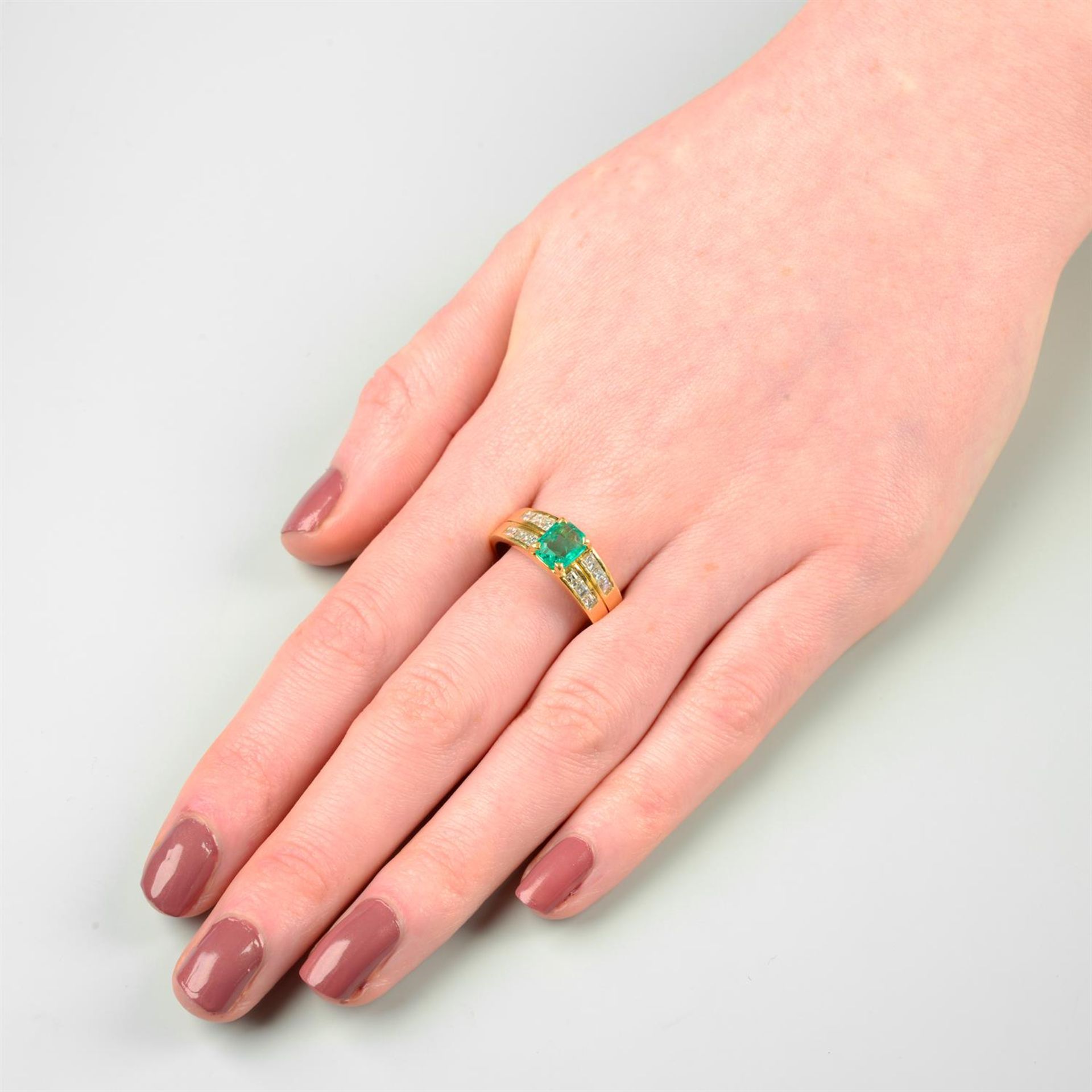 An 18ct gold emerald dress ring, with calibre-cut diamond line sides. - Image 5 of 5