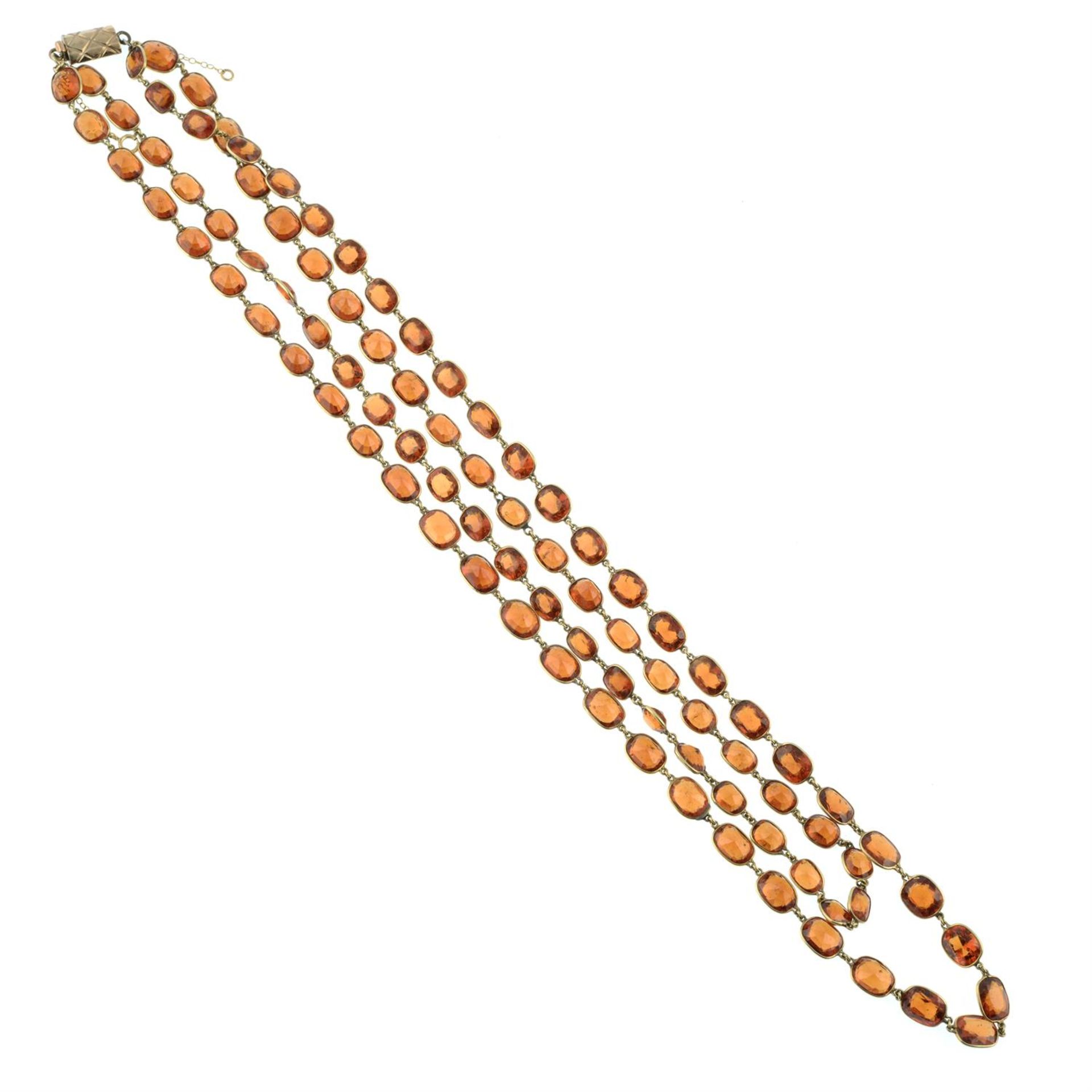 A slightly graduated hessonite garnet two-row rivieré necklace. - Image 3 of 3