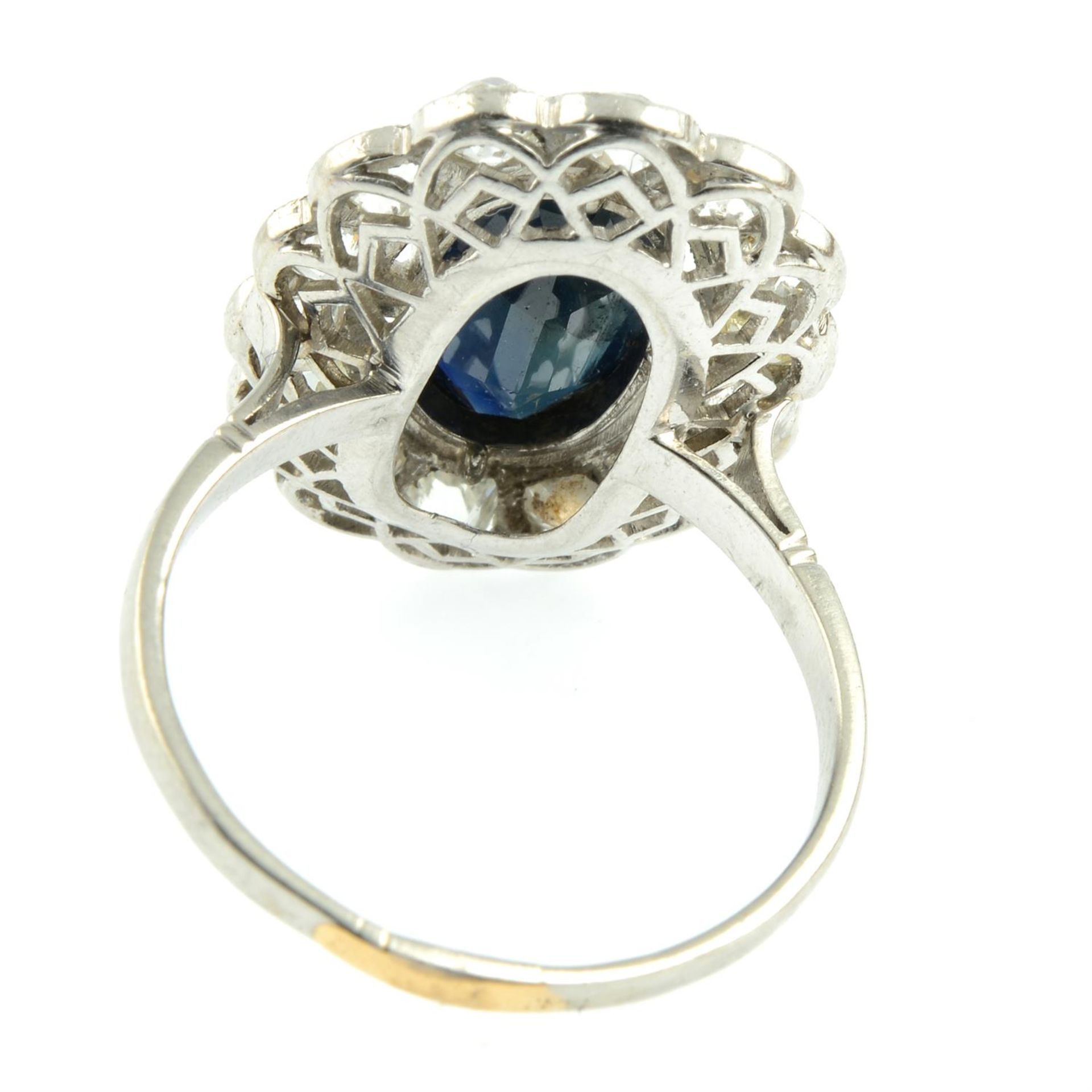 A mid 20th century platinum sapphire and old-cut diamond cluster ring. - Image 4 of 5