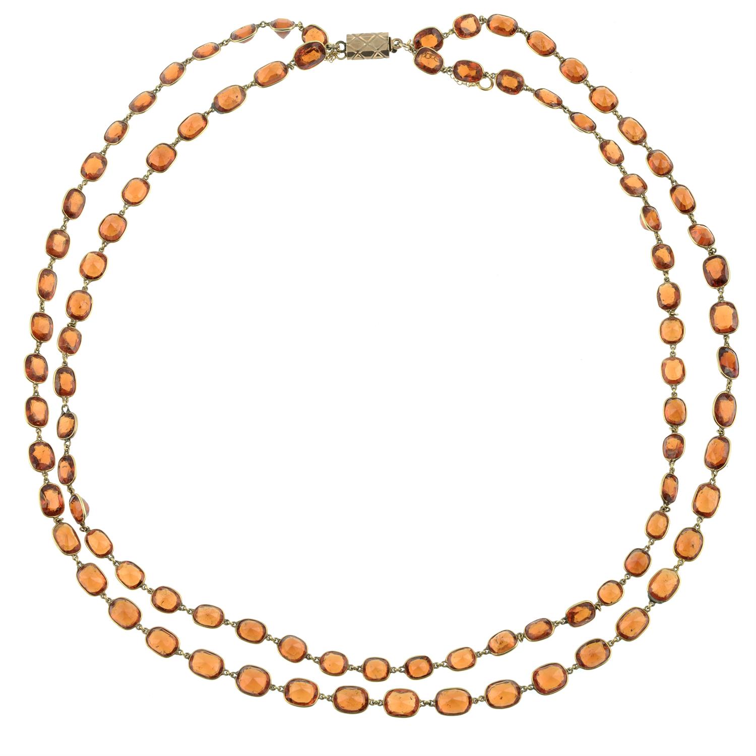 A slightly graduated hessonite garnet two-row rivieré necklace. - Image 2 of 3