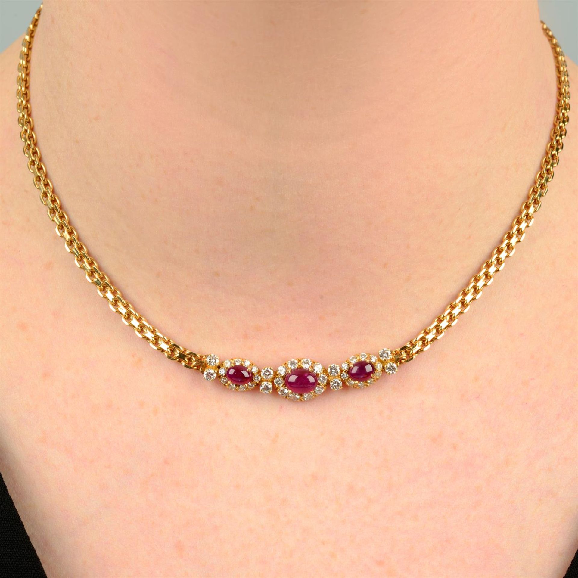 A ruby cabochon and brilliant-cut diamond accent necklace, by Van Cleef & Arpels.