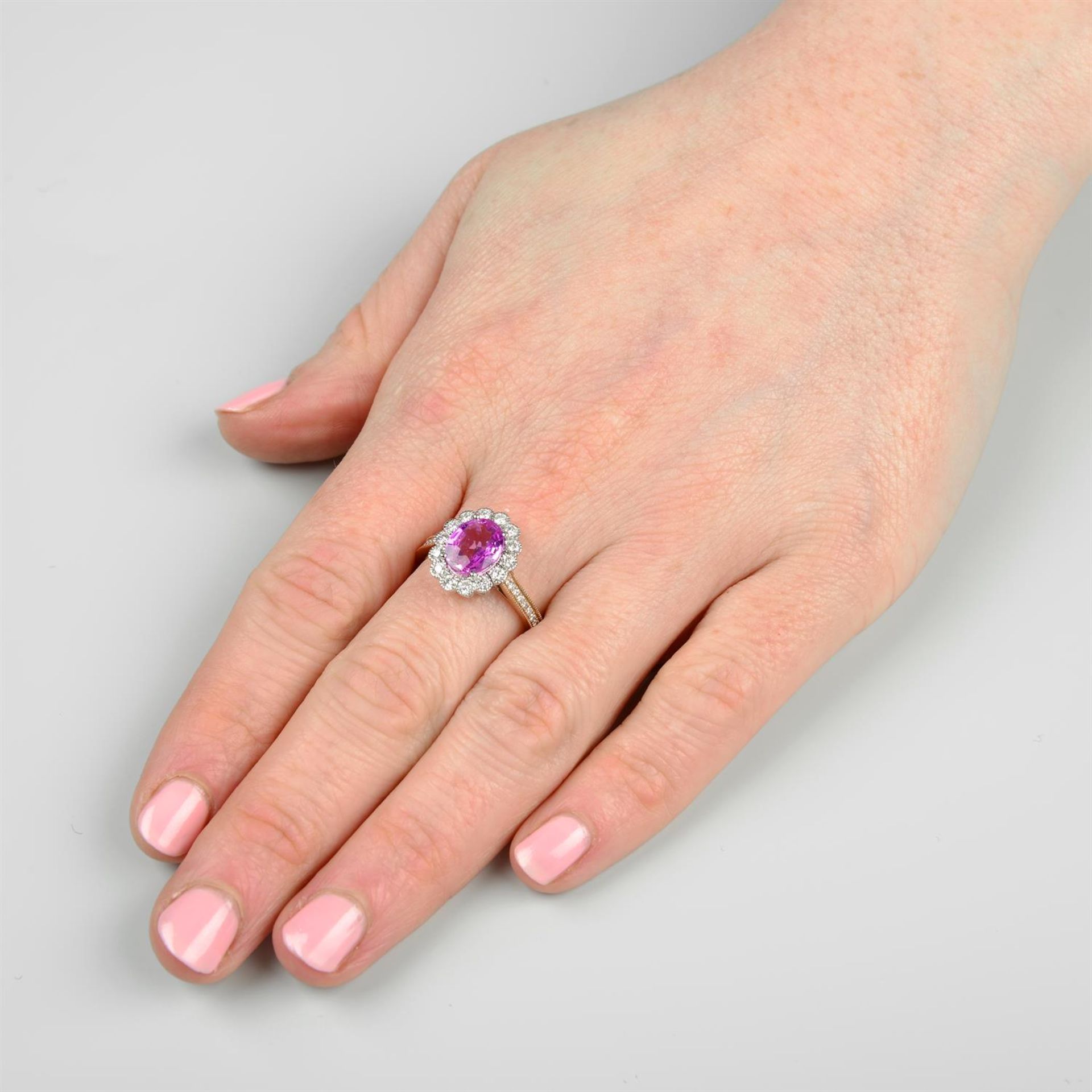 An 18ct gold pink sapphire and brilliant-cut diamond cluster ring. - Image 5 of 5