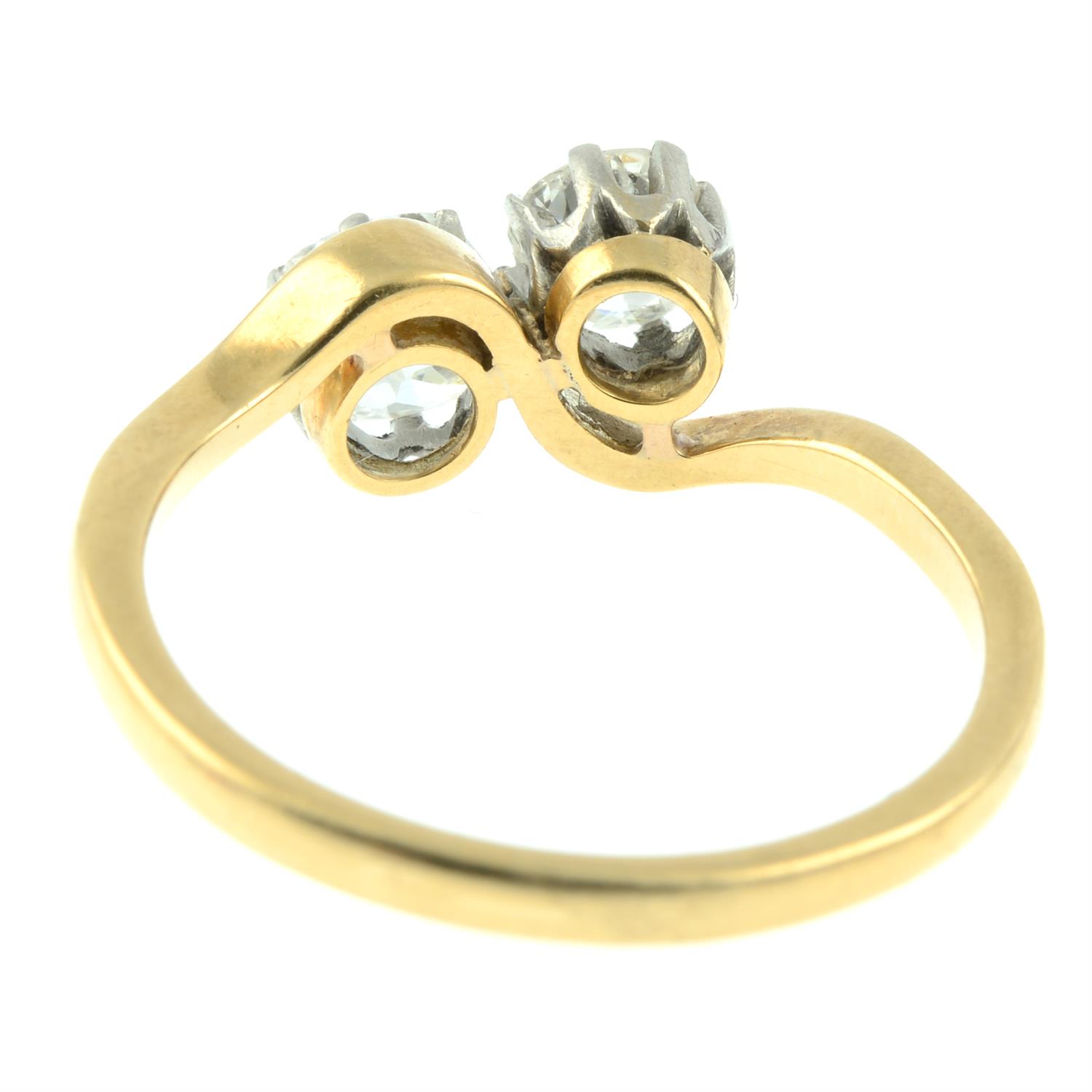 An early 20th century 18ct gold old-cut diamond two-stone crossover ring. - Image 4 of 5