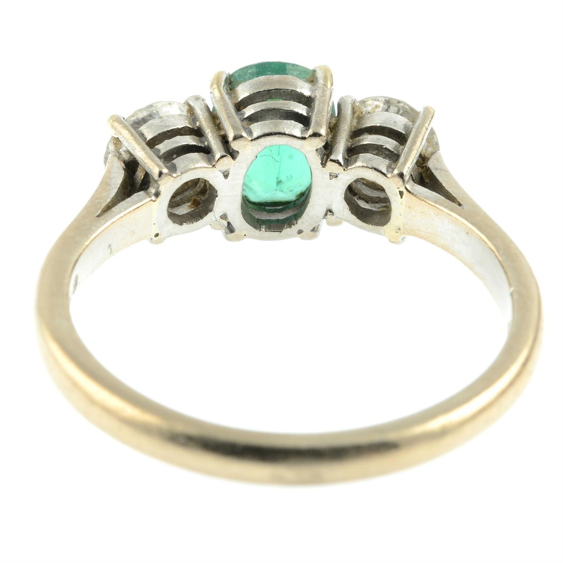 An 18ct gold emerald and brilliant-cut diamond three-stone ring. - Image 4 of 5