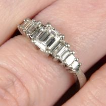 A platinum graduated baguette-cut diamond dress ring.