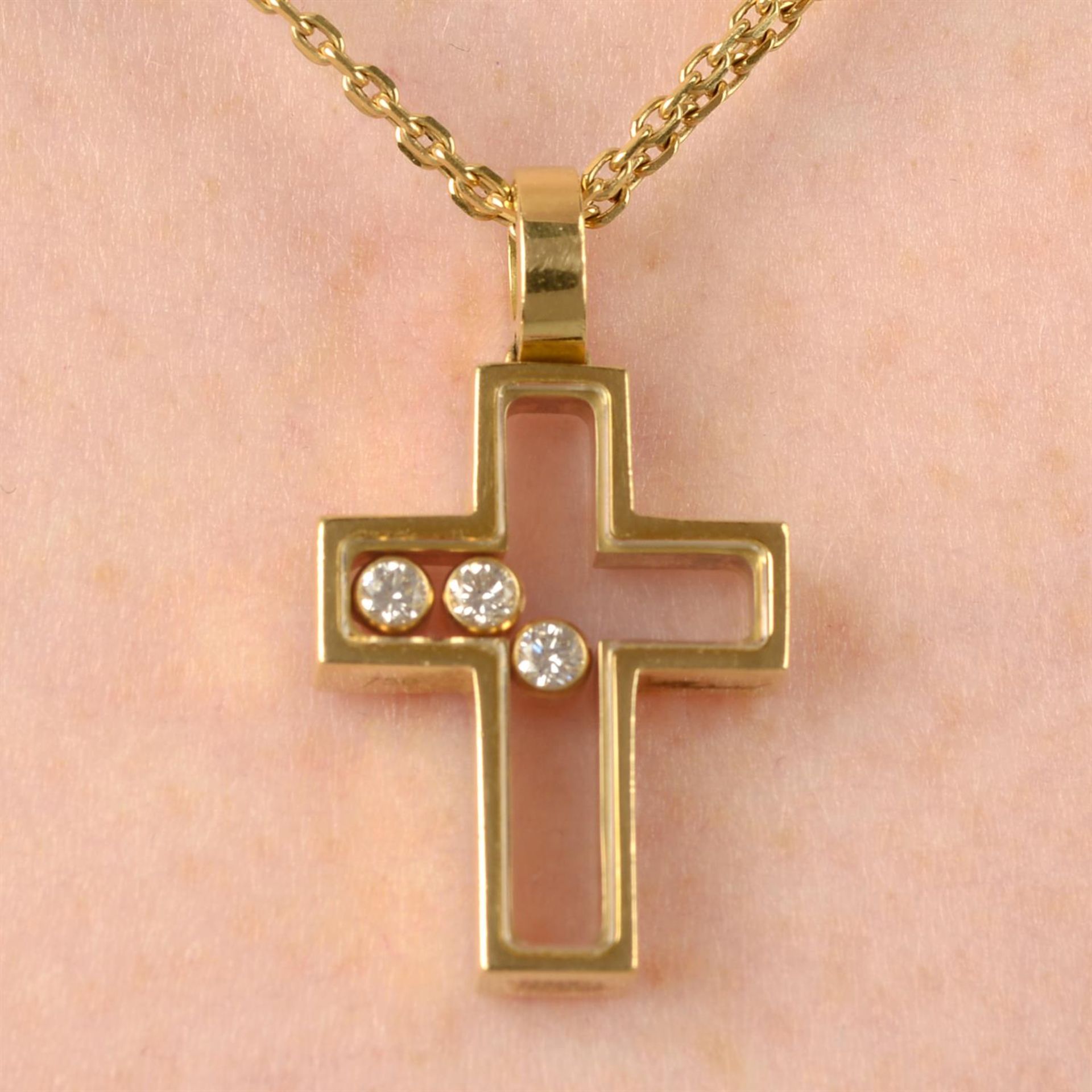 A 'Happy Diamonds' cross pendant, with 18ct gold chain, by Chopard.