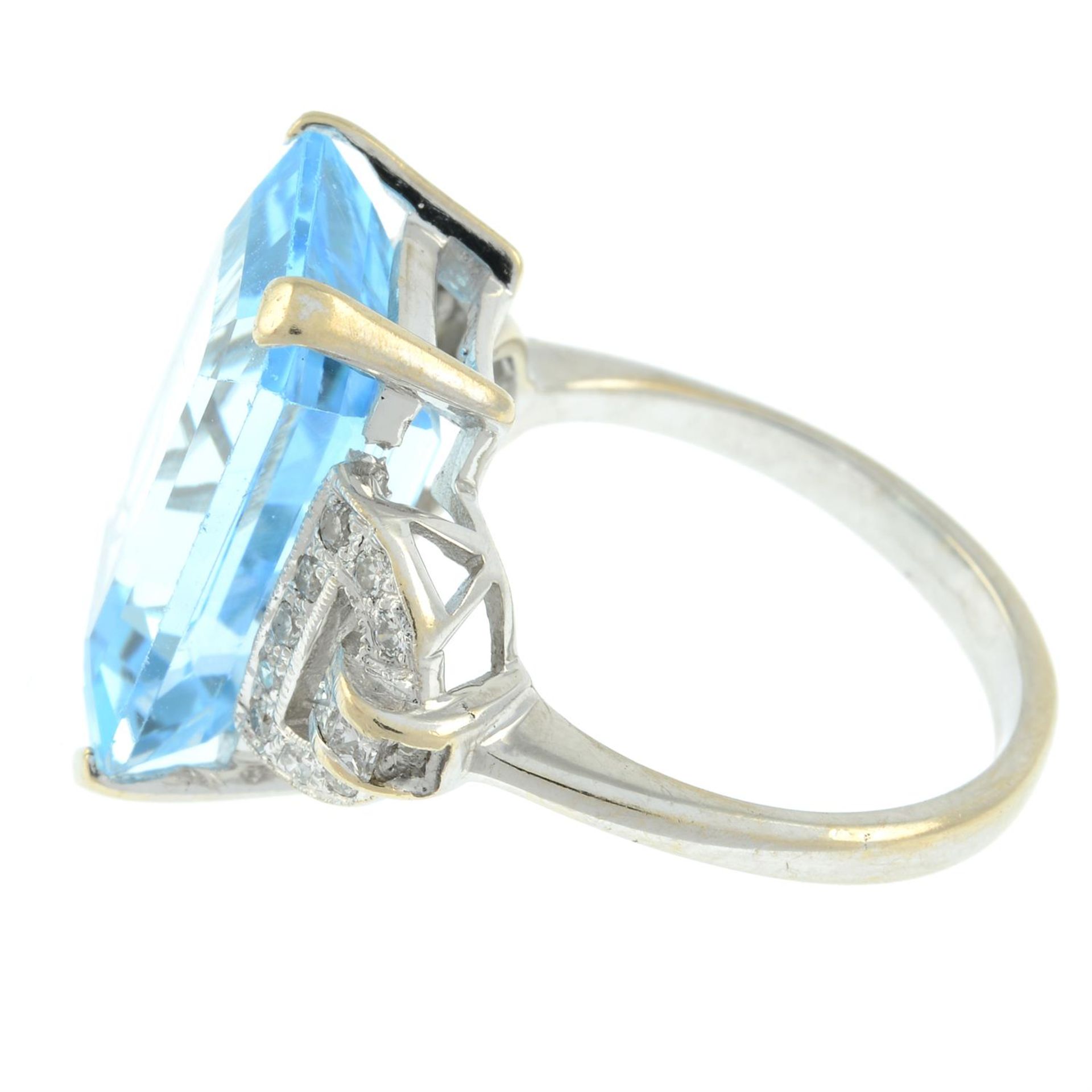 An 18ct gold blue topaz single-stone ring, with vari-cut diamond geometric sides. - Image 4 of 5