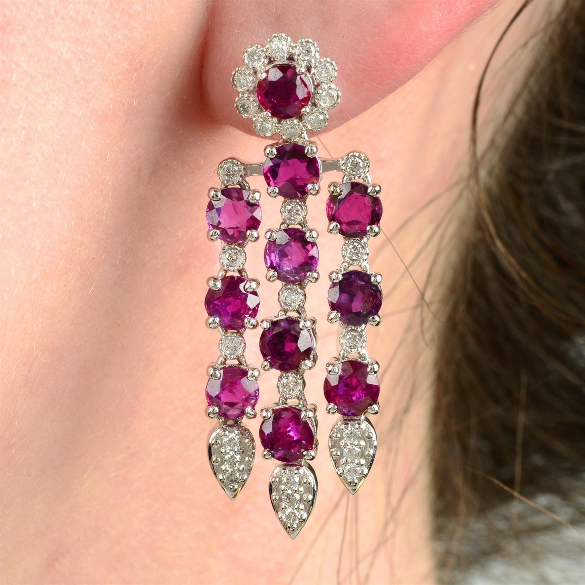 A pair of ruby and brilliant-cut diamond floral drop earrings.