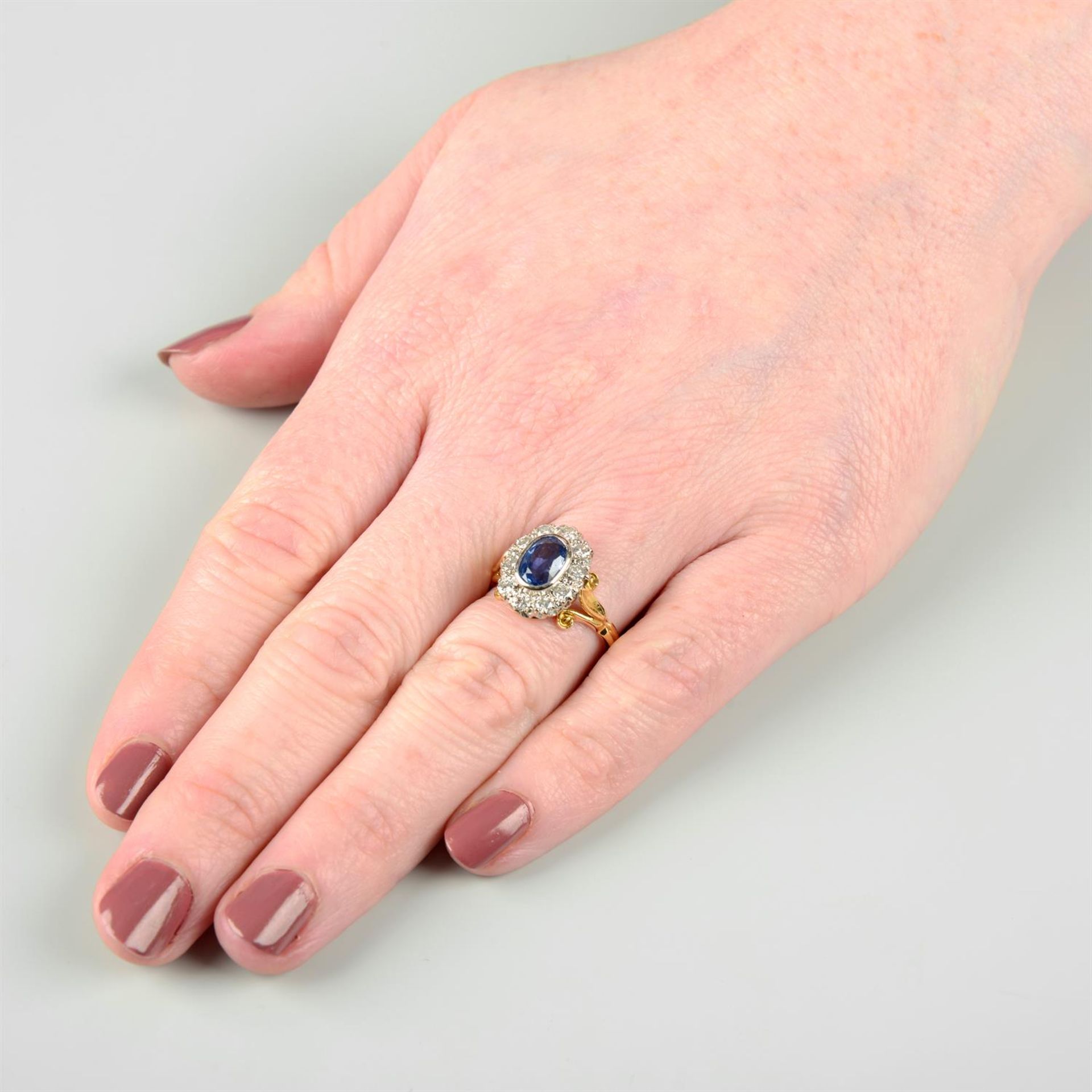 An 18ct gold sapphire and brilliant-cut diamond cluster ring. - Image 5 of 5