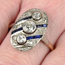 An Art Deco platinum and 14ct gold vari-cut diamond and sapphire geometric ring.