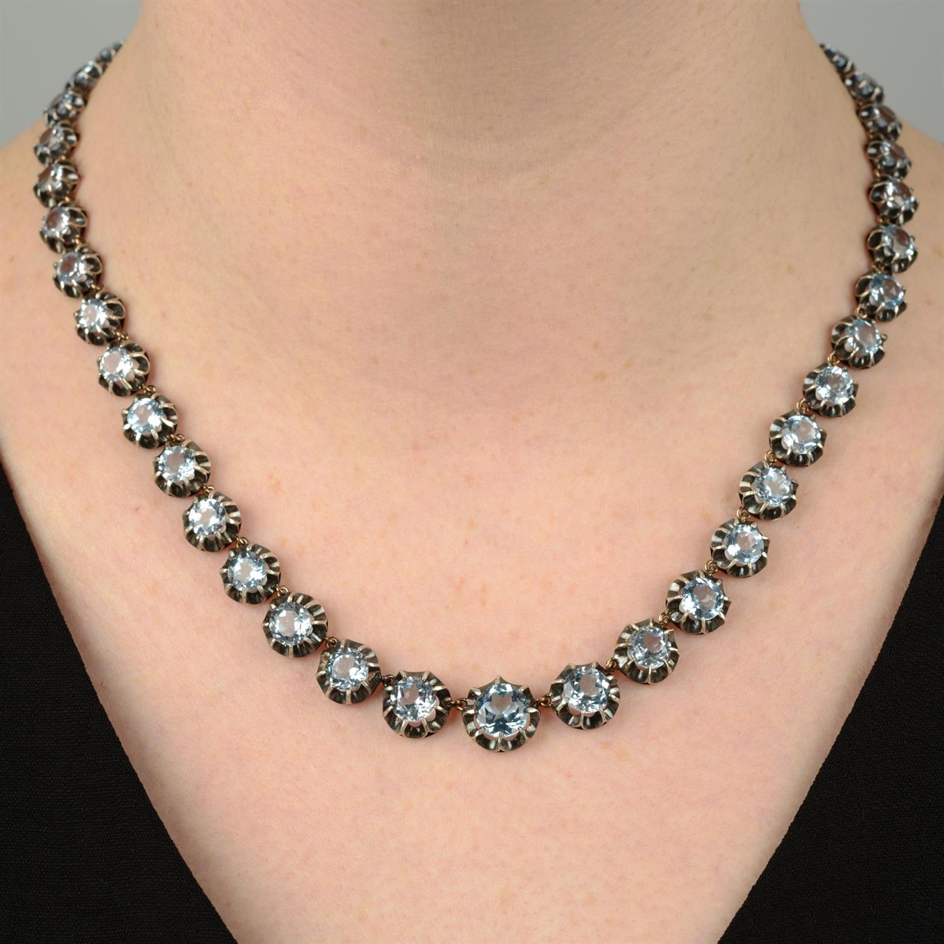 A 19th century silver and gold blue topaz rivière necklace.