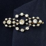 A late Victorian palladium and gold old-cut diamond bow brooch.