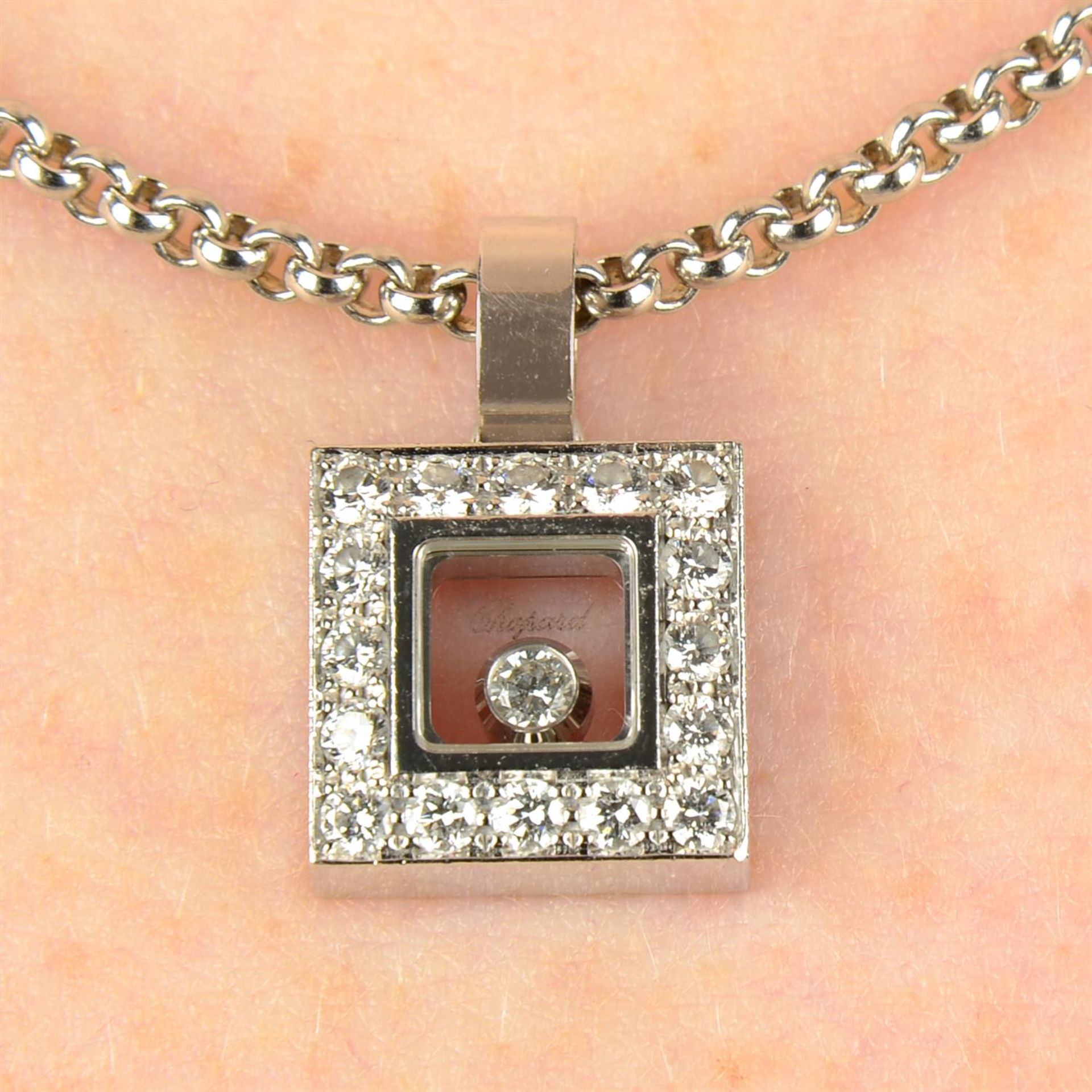 An 18ct gold 'Happy Diamonds' pendant, with chain, by Chopard.