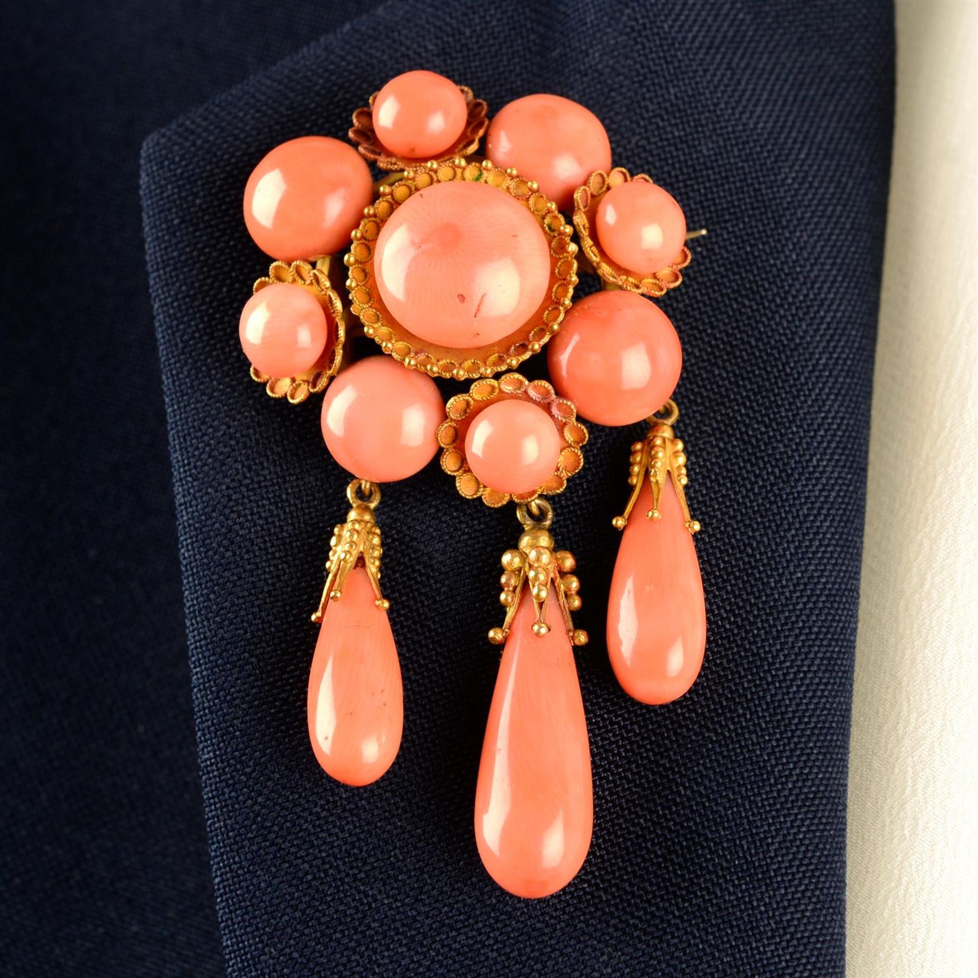 A mid to late 19th century gold coral brooch, with drop fringe, by Luigi Casalta.