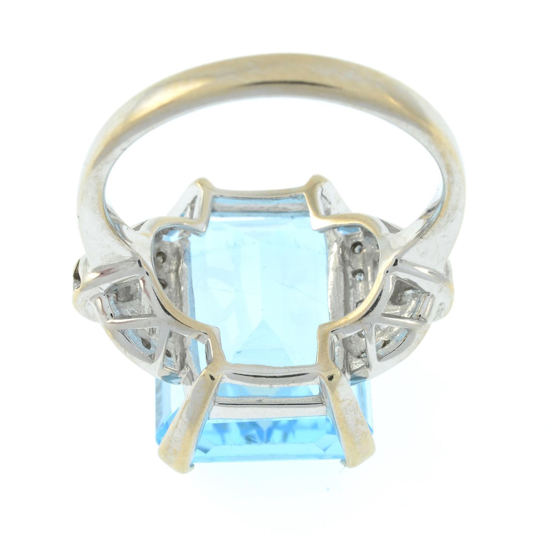 An 18ct gold blue topaz single-stone ring, with vari-cut diamond geometric sides. - Image 3 of 5