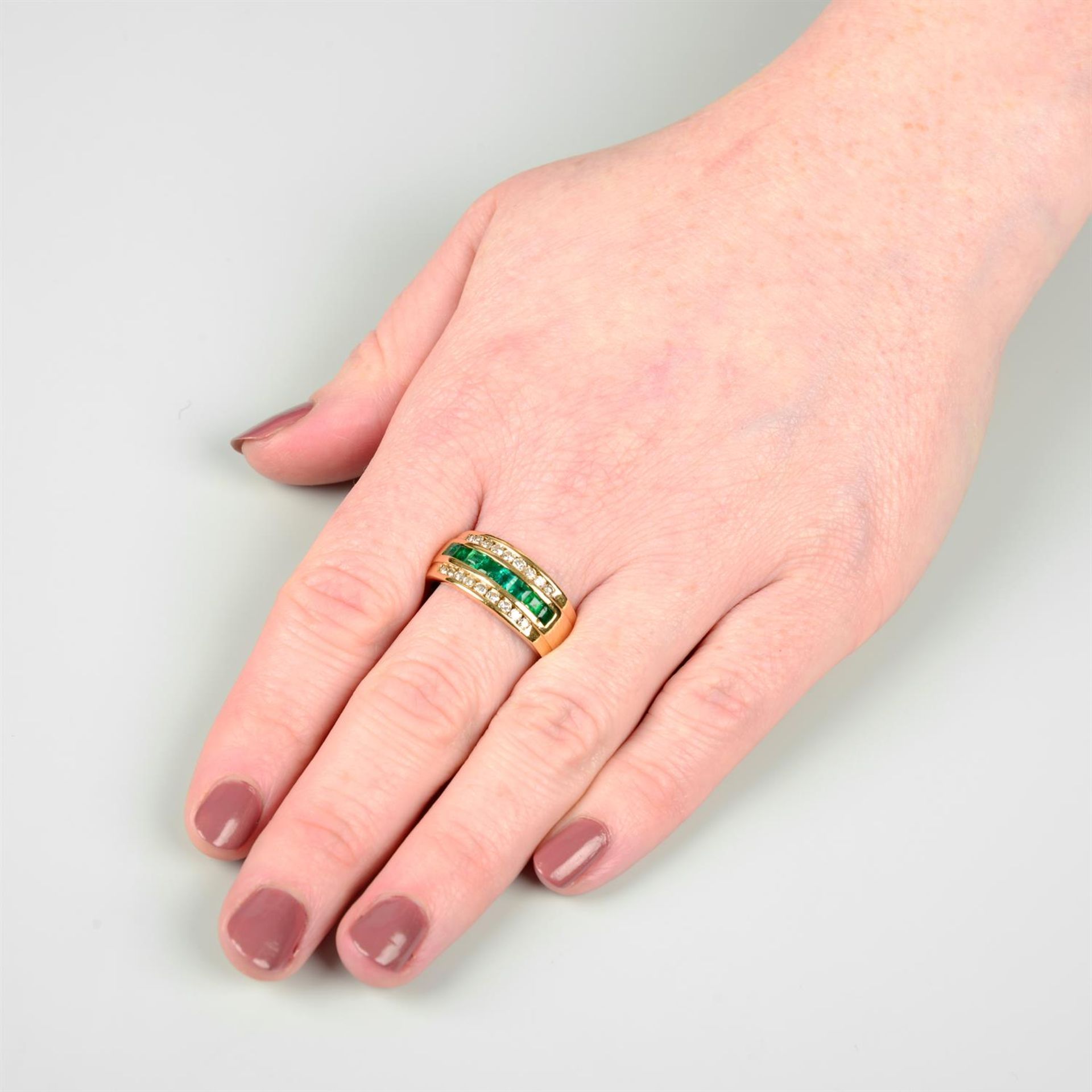 An 18ct gold brilliant-cut diamond and emerald three-row band ring. - Image 5 of 5