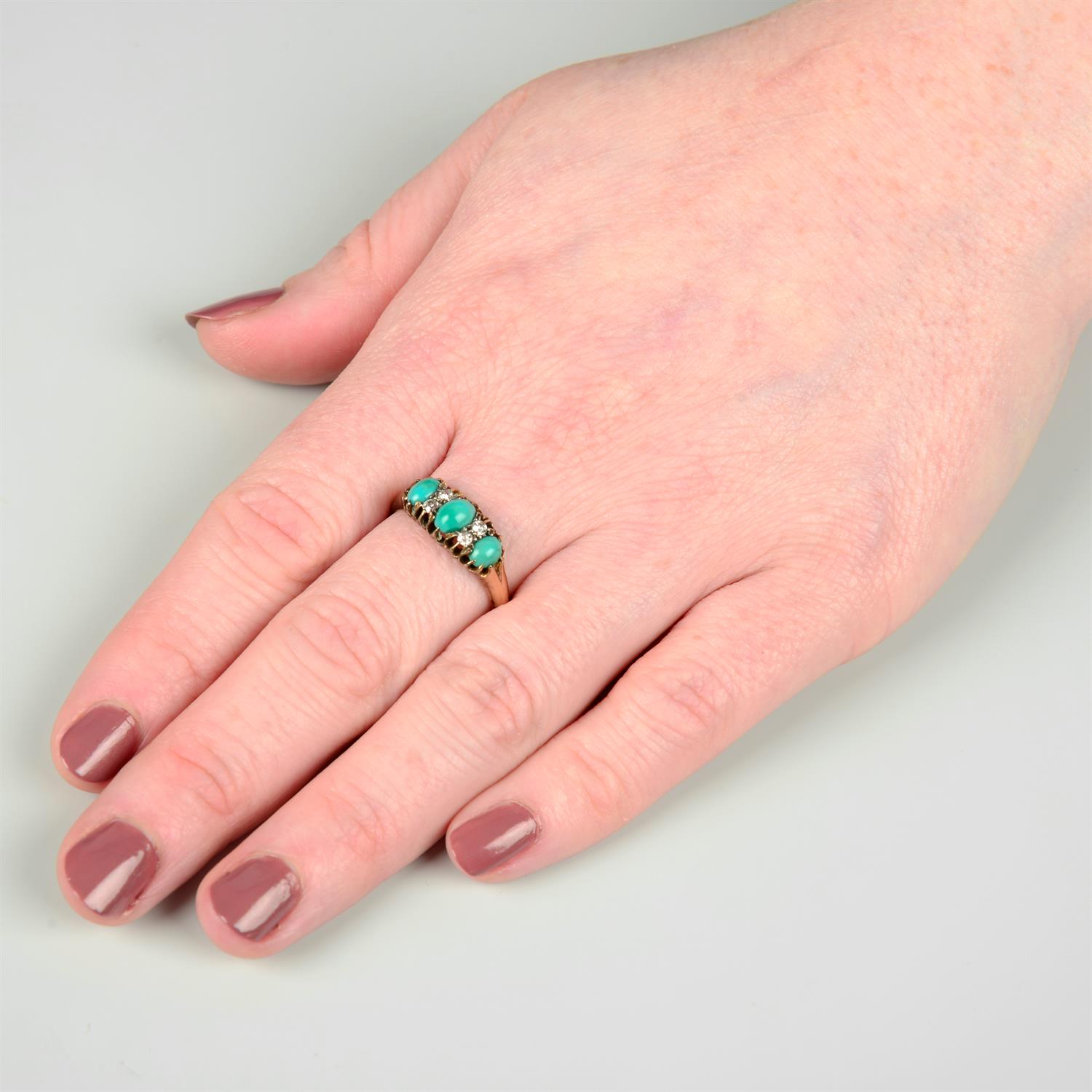 An early 20th century 18ct gold graduated turquoise three-stone ring, with old-cut diamond spacers. - Image 5 of 5