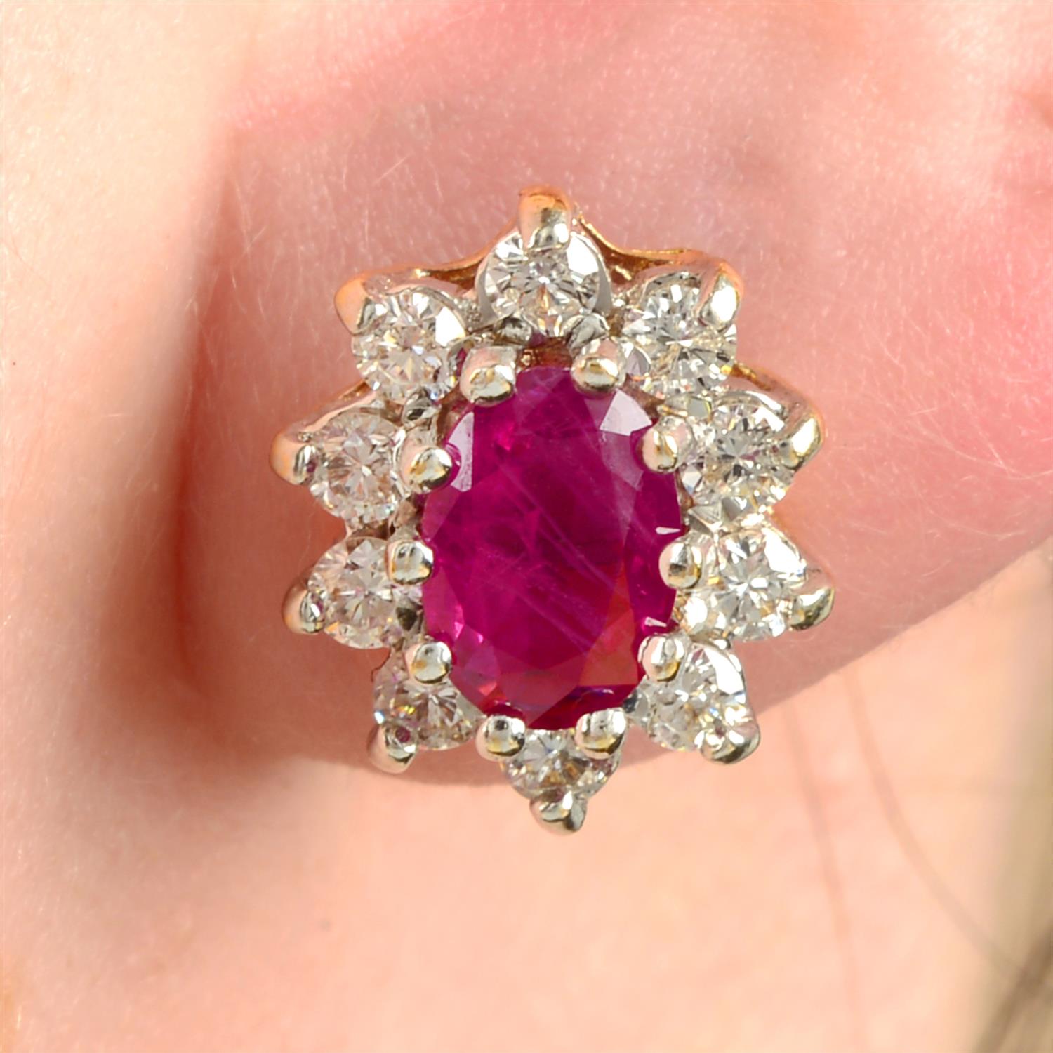 A pair of 18ct gold ruby and brilliant-cut diamond cluster earrings.