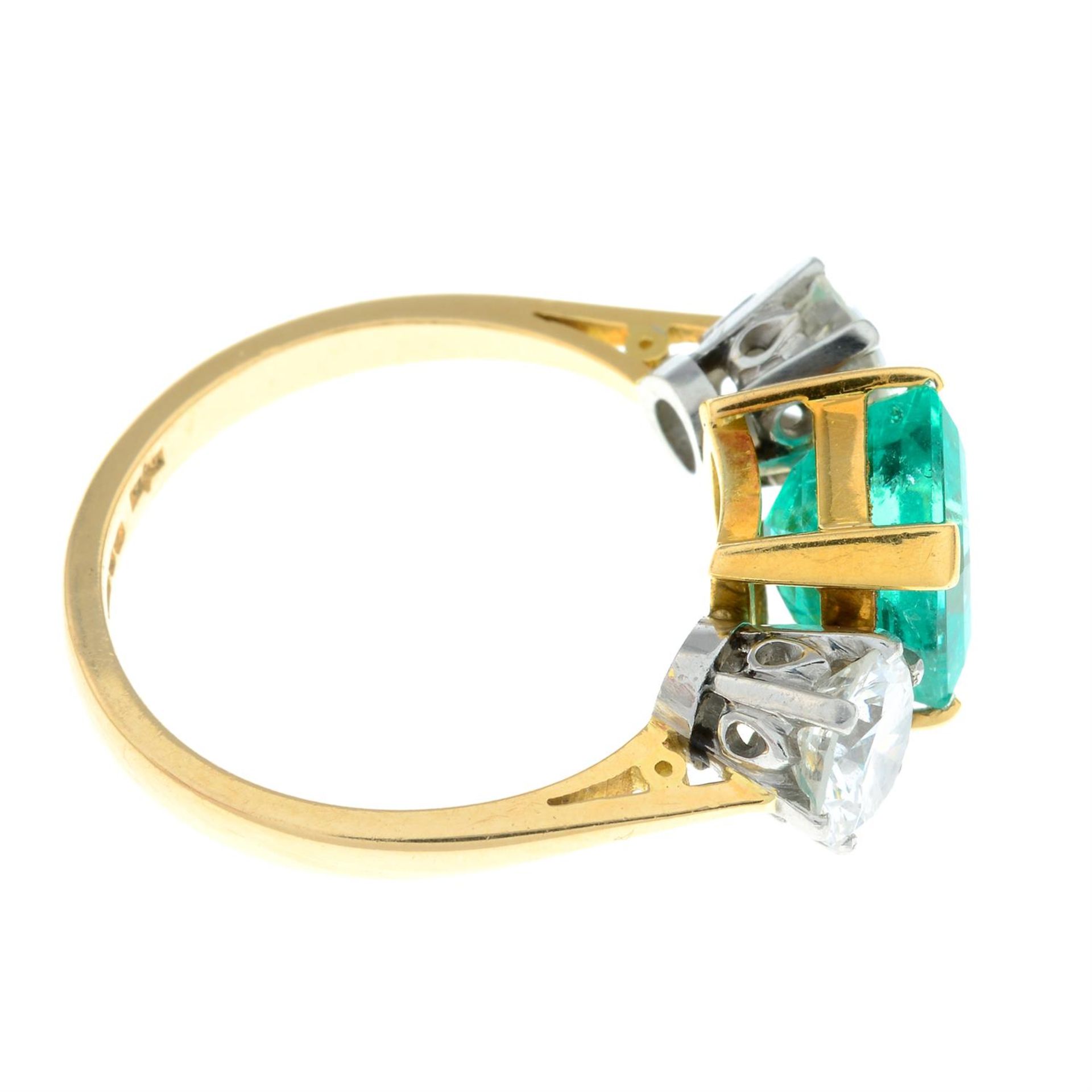 An 18ct gold emerald and brilliant-cut diamond three-stone ring. - Image 5 of 6