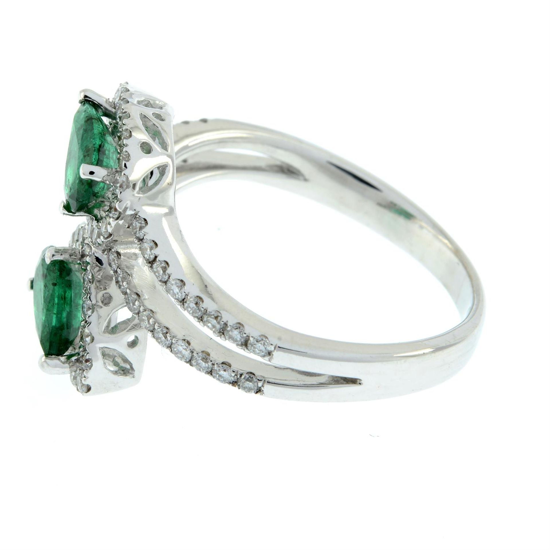 An emerald and brilliant-cut diamond crossover ring. - Image 4 of 5